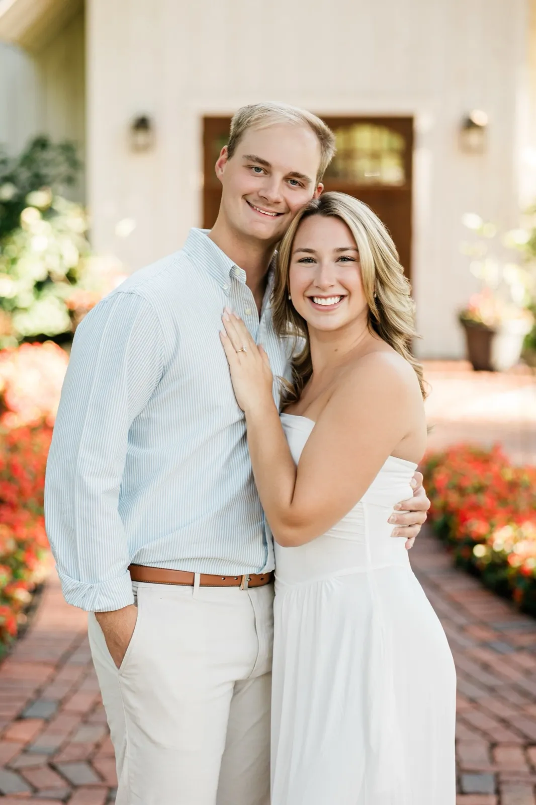Olivia and Adam smile cheek to cheek, her ring hand resting on his chest — Tim Larsen Photography