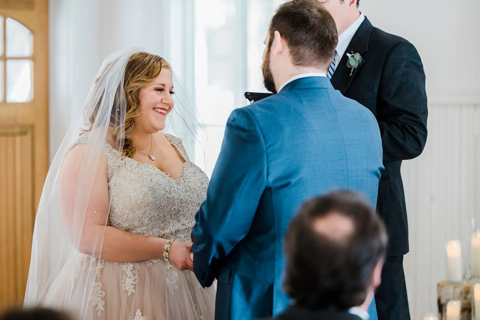 Lauren smiling during the ceremony — chapel with natural light at Grand View Lodge — Tim Larsen Photography, Brainerd Lakes MN