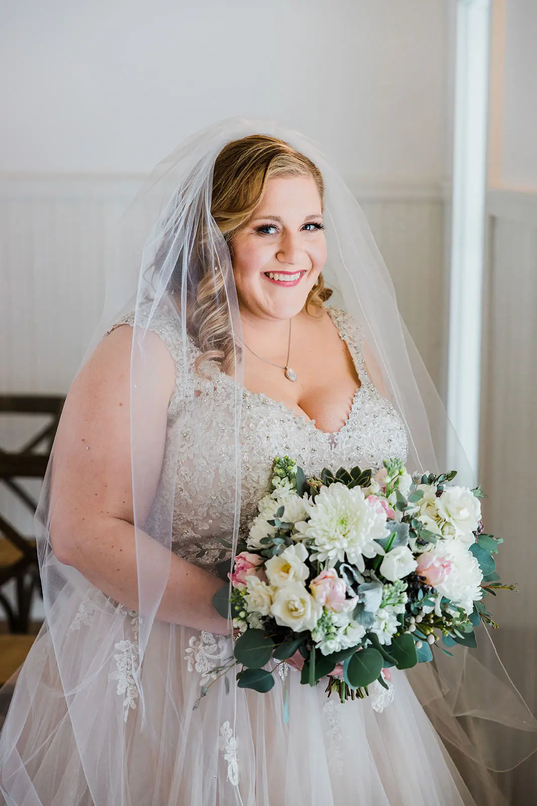 Lauren smiling with bouquet — bridal portrait at Grand View Lodge chapel — Tim Larsen Photography, Brainerd Lakes MN