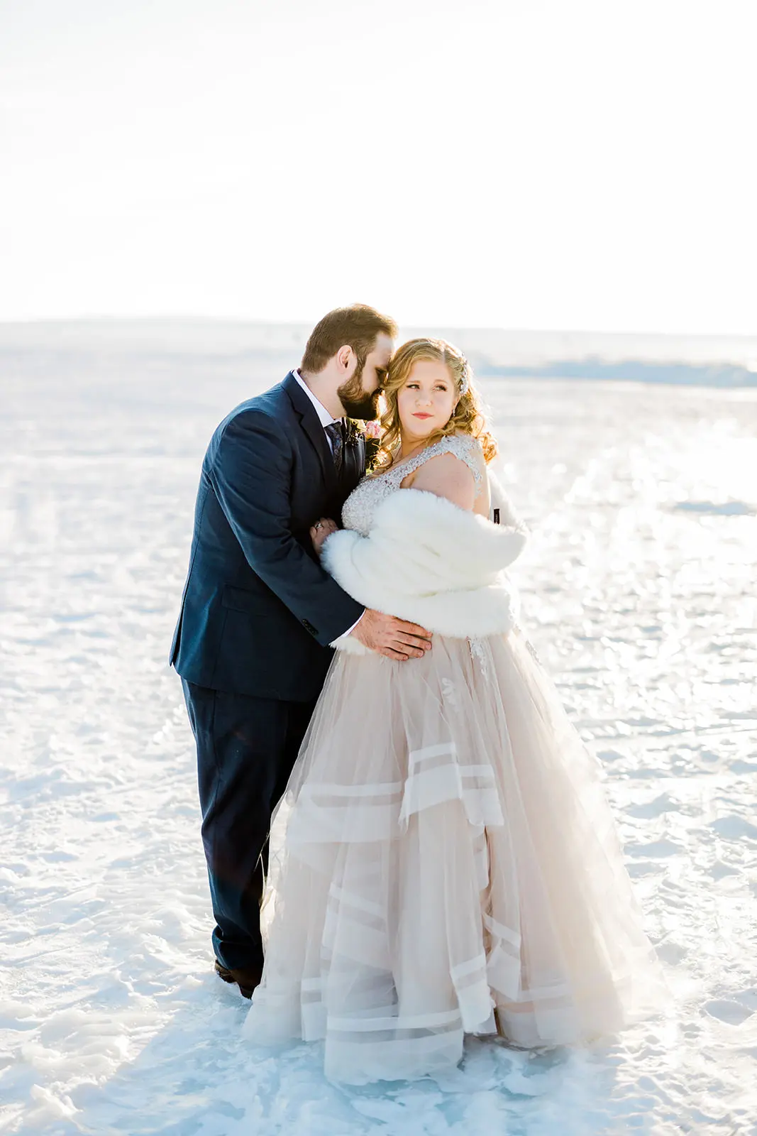 Couple portrait on frozen Gull Lake — winter golden hour at Grand View Lodge — Tim Larsen Photography, Brainerd Lakes MN