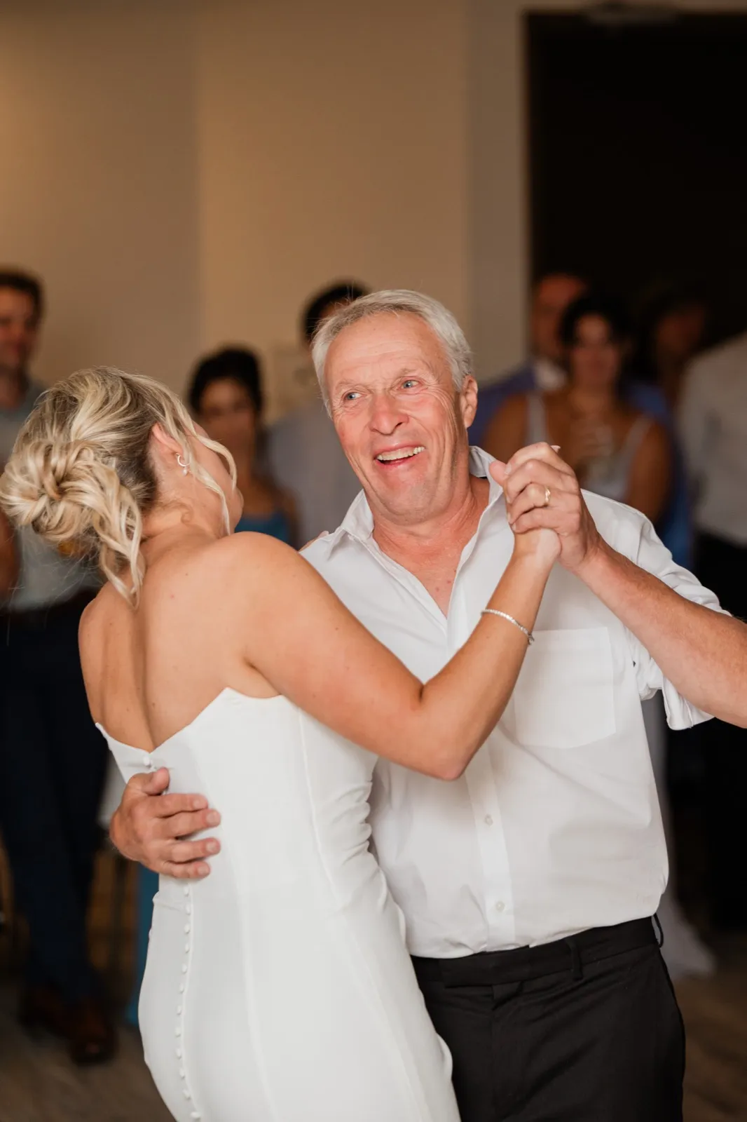 Amy dances with the man who walked her down the aisle, his shirtsleeves rolled and his whole face lit up — Tim Larsen Photography, Brainerd Lakes MN