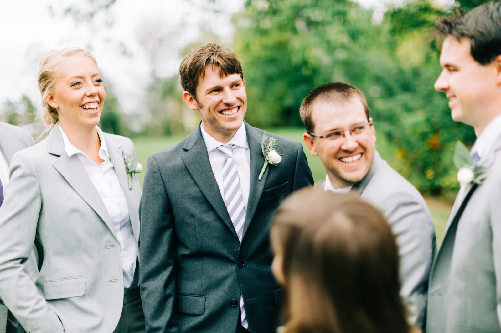 Brenden laughs with his groomsmen and groomswoman on the lawn at Madden's on Gull Lake — Tim Larsen Photography, Brainerd Lakes MN