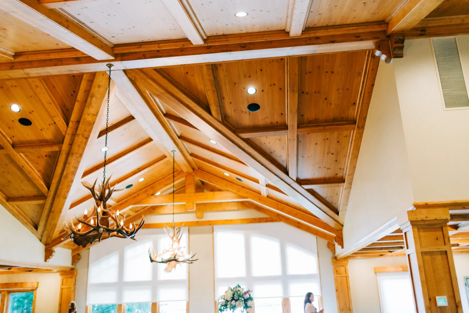 Antler chandeliers hang from the vaulted timber ceiling of the reception hall at Madden's on Gull Lake — Tim Larsen Photography, Brainerd Lakes MN
