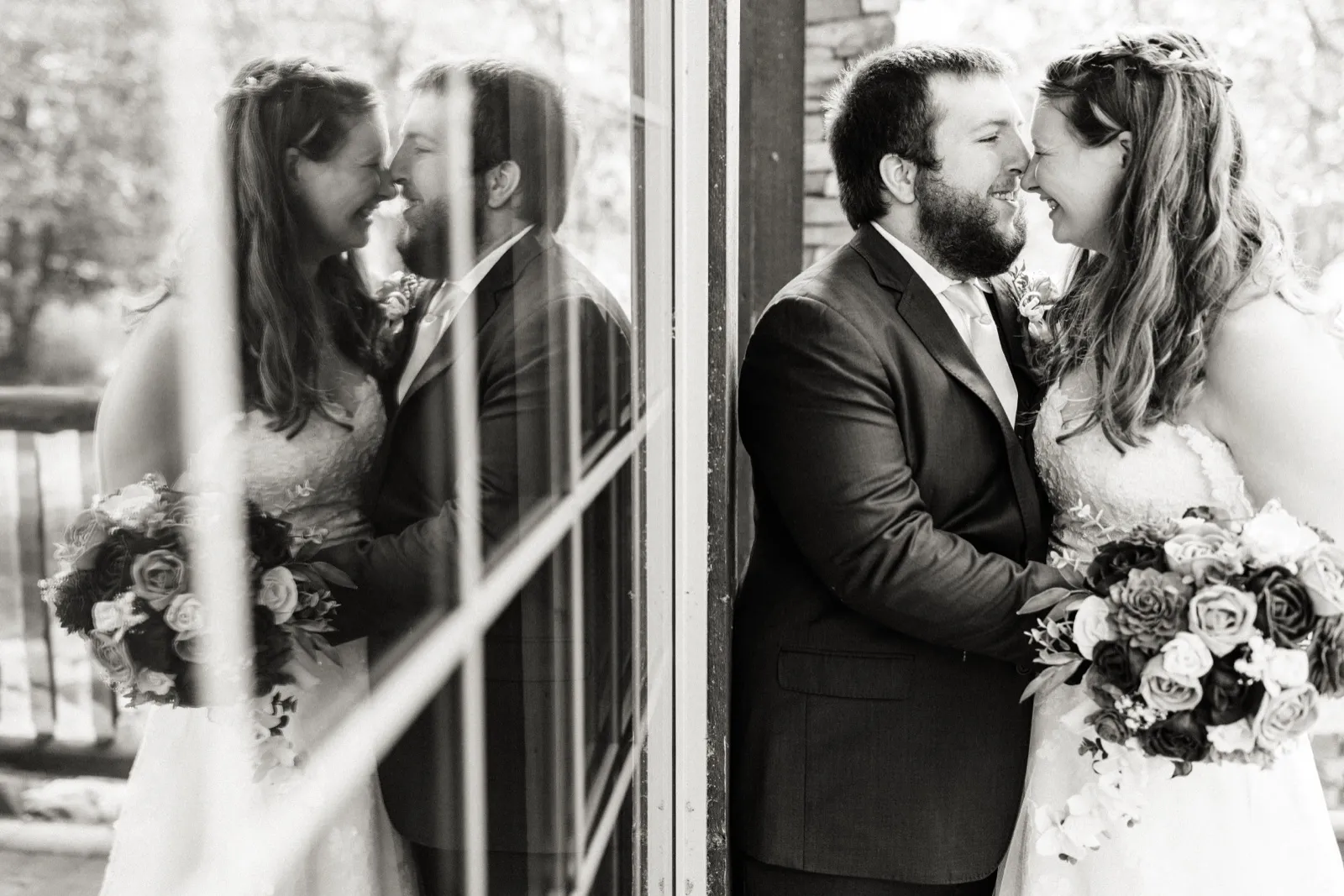 Maddie and Cody lean close beside a window that reflects their faces in black and white — Tim Larsen Photography, Brainerd Lakes MN
