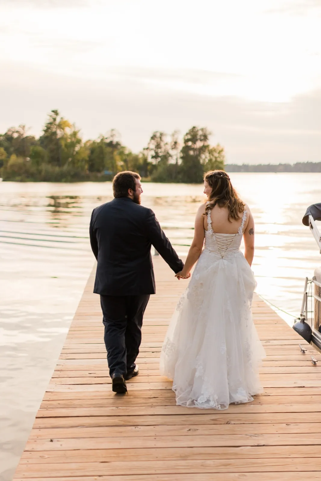Maddie and Cody walk hand in hand along the dock at Cross Lake Recreation Area — Tim Larsen Photography, Brainerd Lakes MN
