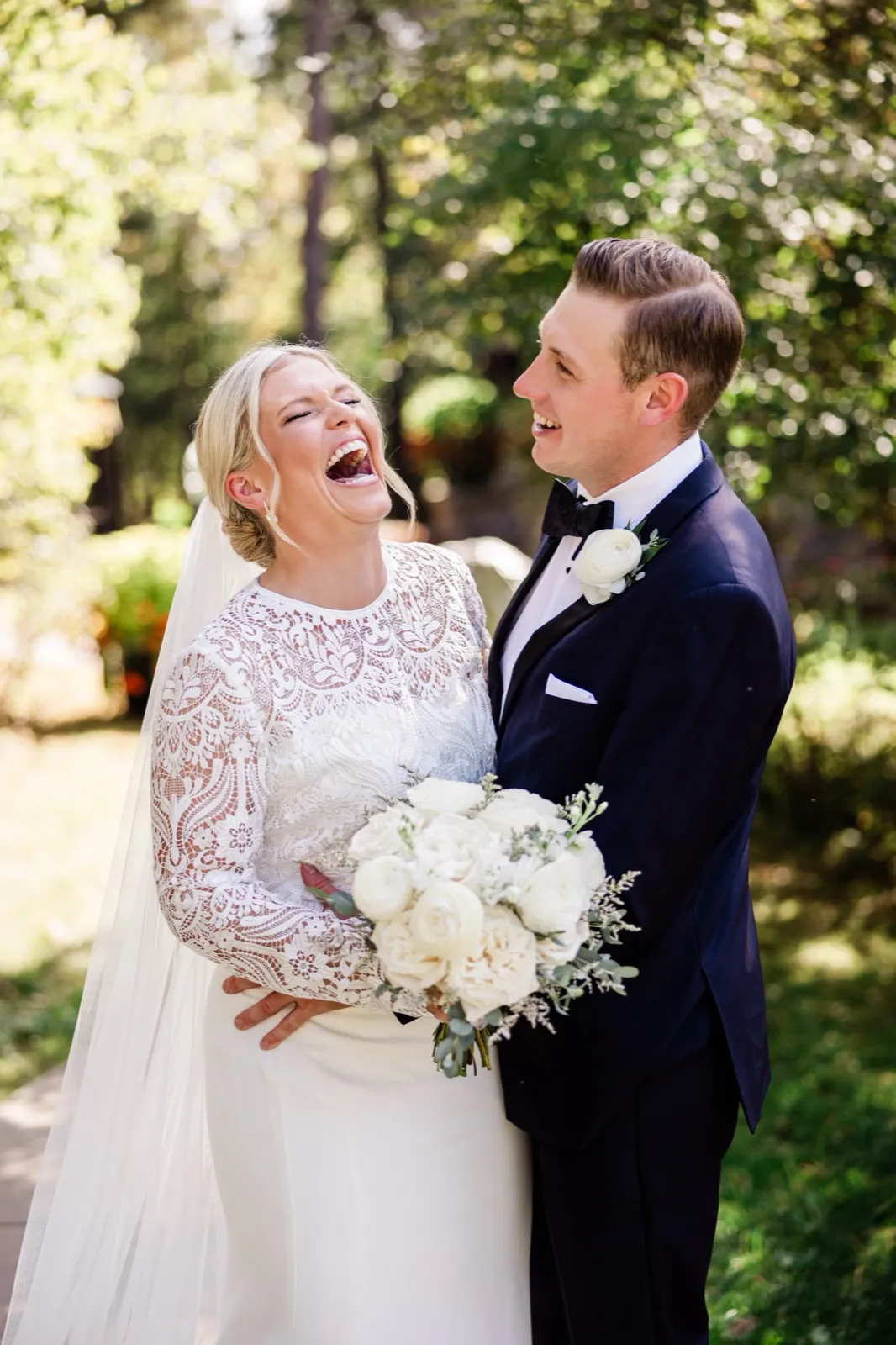 A couple kisses on a garden path framed by autumn foliage at Grand View Lodge — Tim Larsen Photography, Brainerd Lakes MN