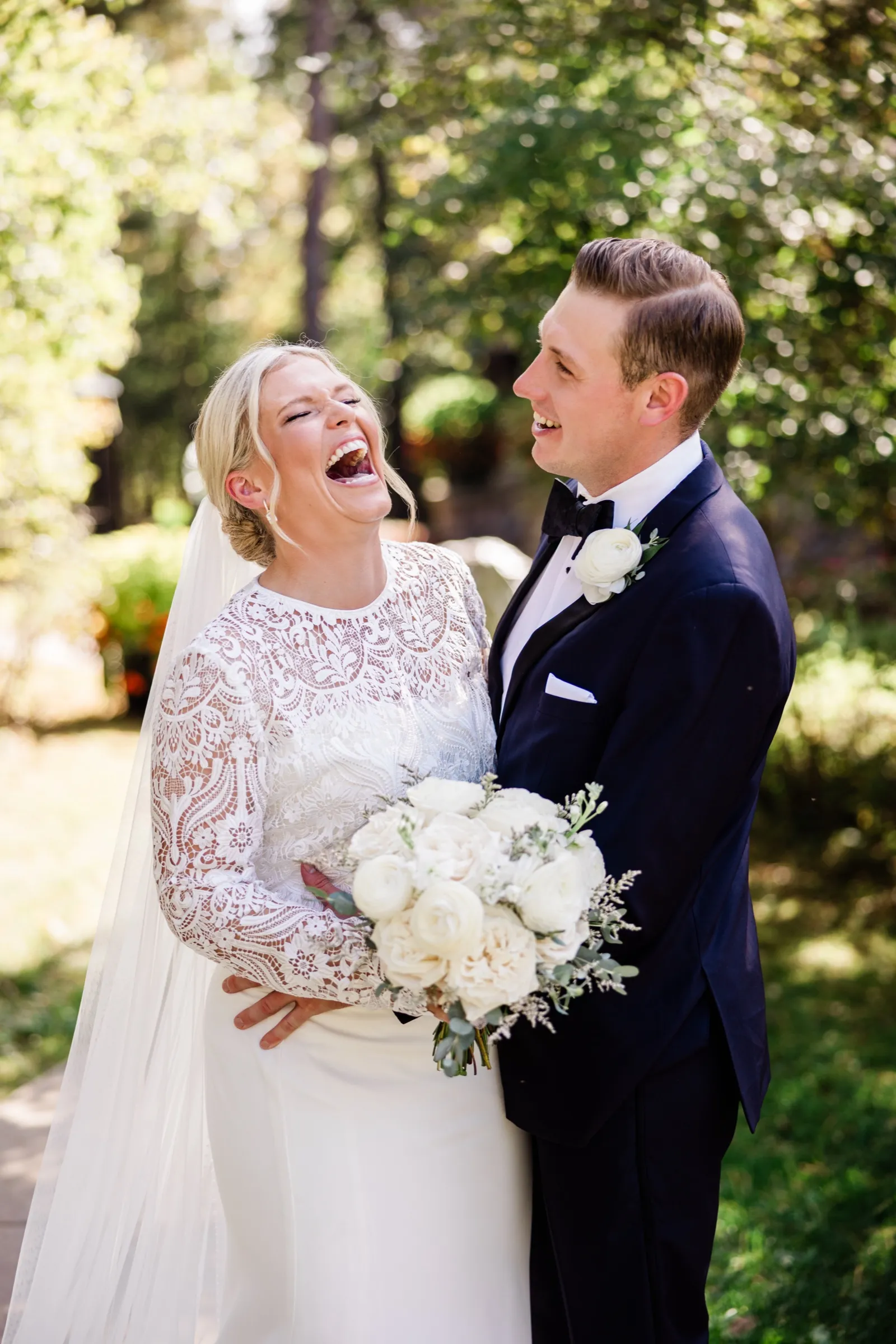 A couple kisses on a garden path framed by autumn foliage at Grand View Lodge — Tim Larsen Photography, Brainerd Lakes MN