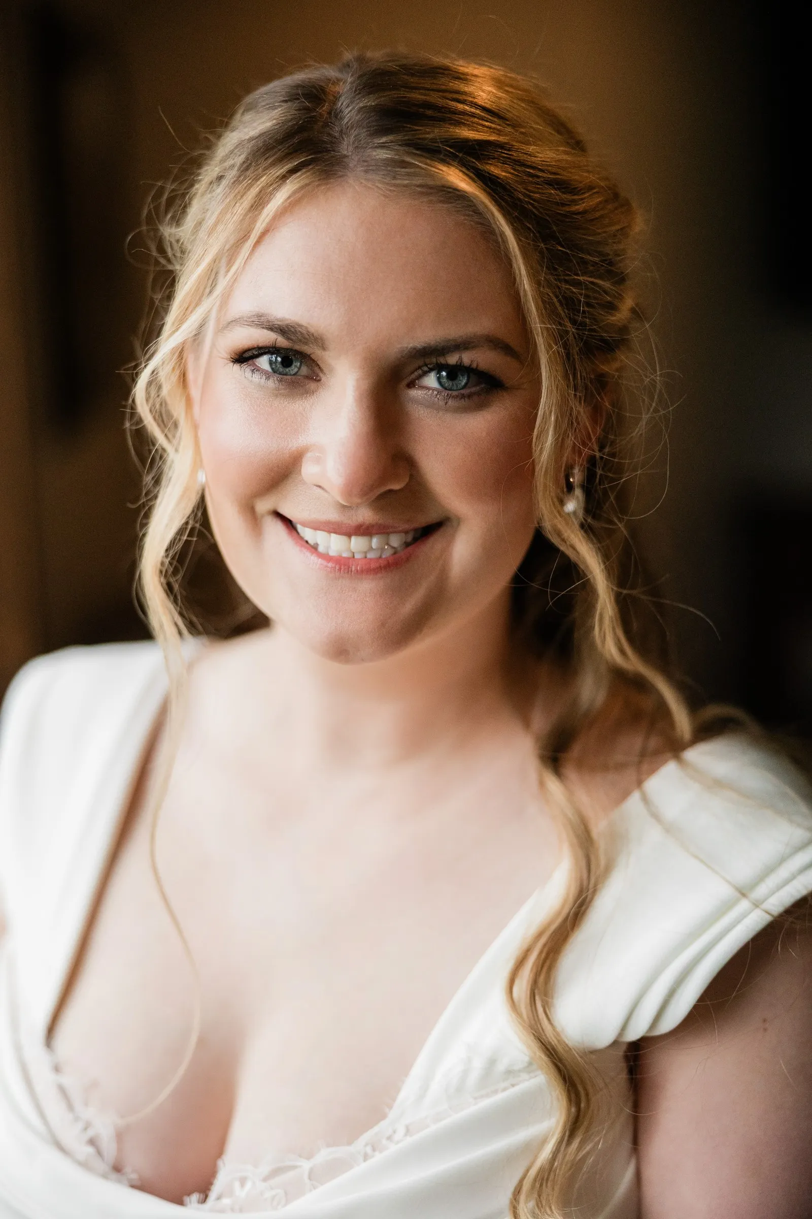 A close portrait of Lauren smiling in her white wedding gown — Tim Larsen Photography, Brainerd Lakes MN