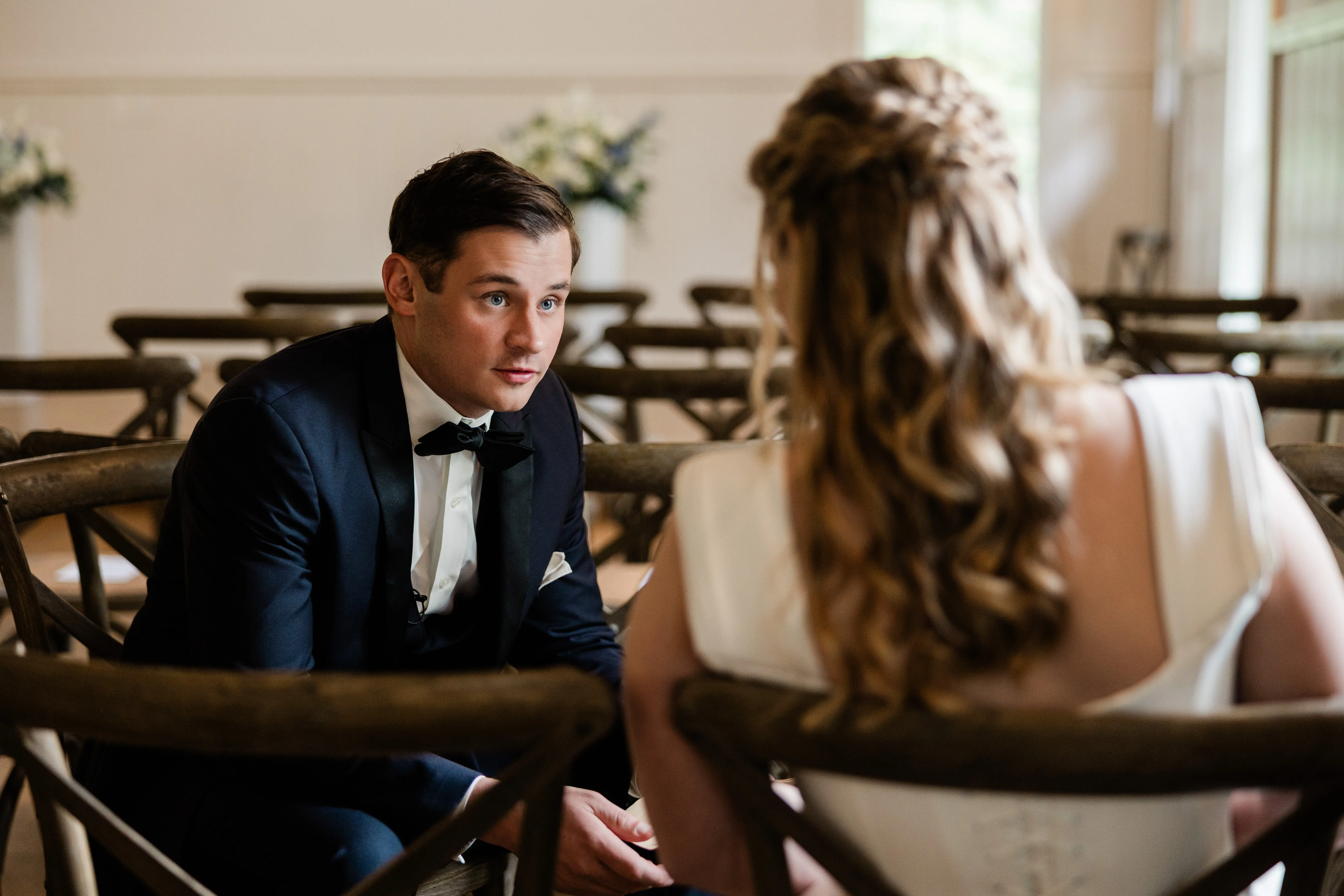 Noah leans toward Lauren during their quiet time together in the Chapel — Tim Larsen Photography, Brainerd Lakes MN