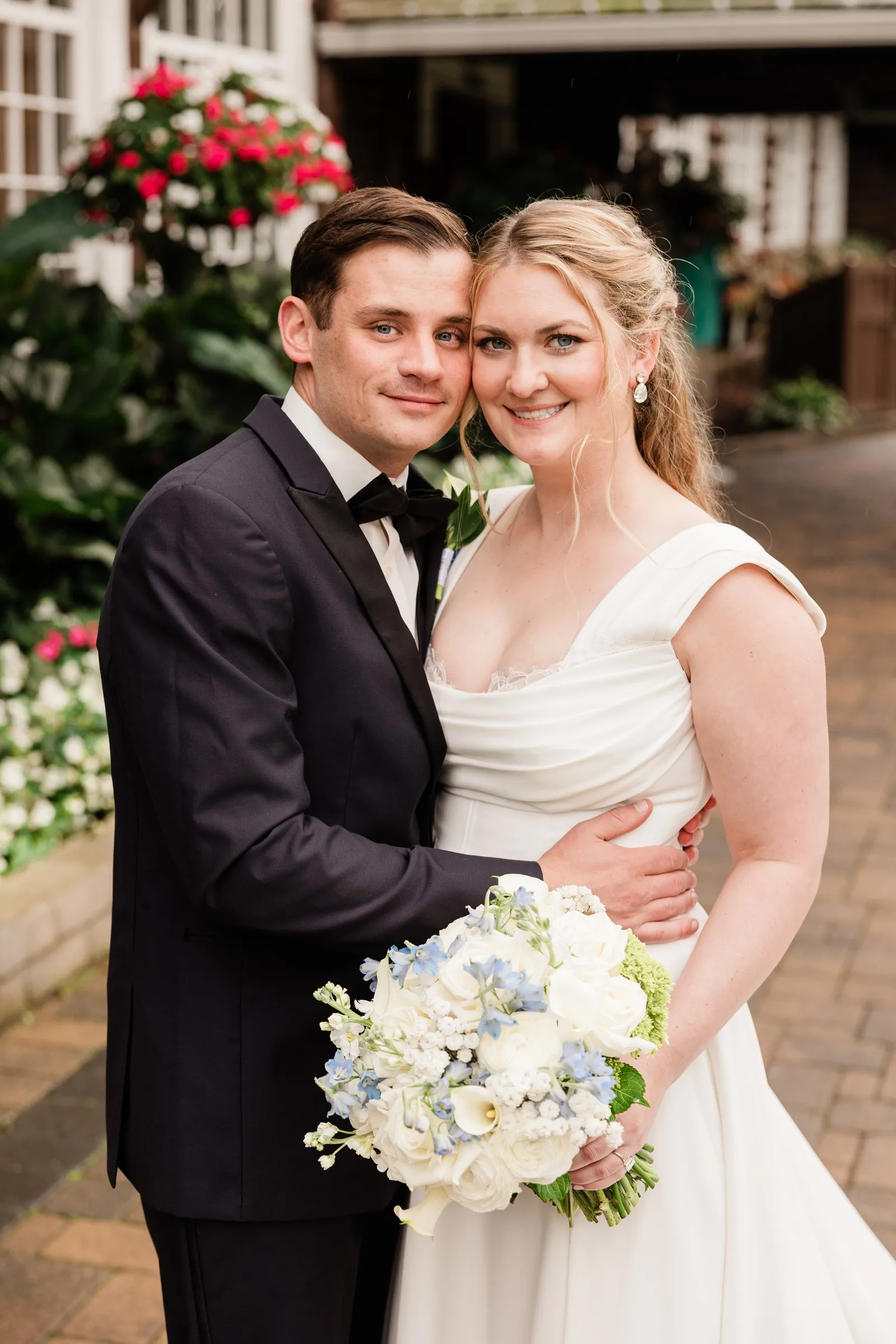 Lauren and Noah hold each other for a portrait outside the lodge — Tim Larsen Photography, Brainerd Lakes MN