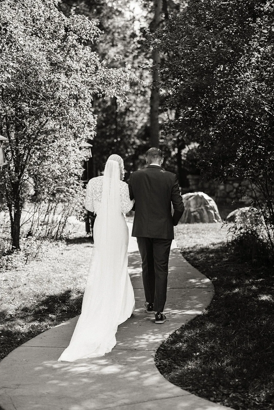 Couple walking away on the garden path — black and white — Tim Larsen Photography, Brainerd Lakes MN