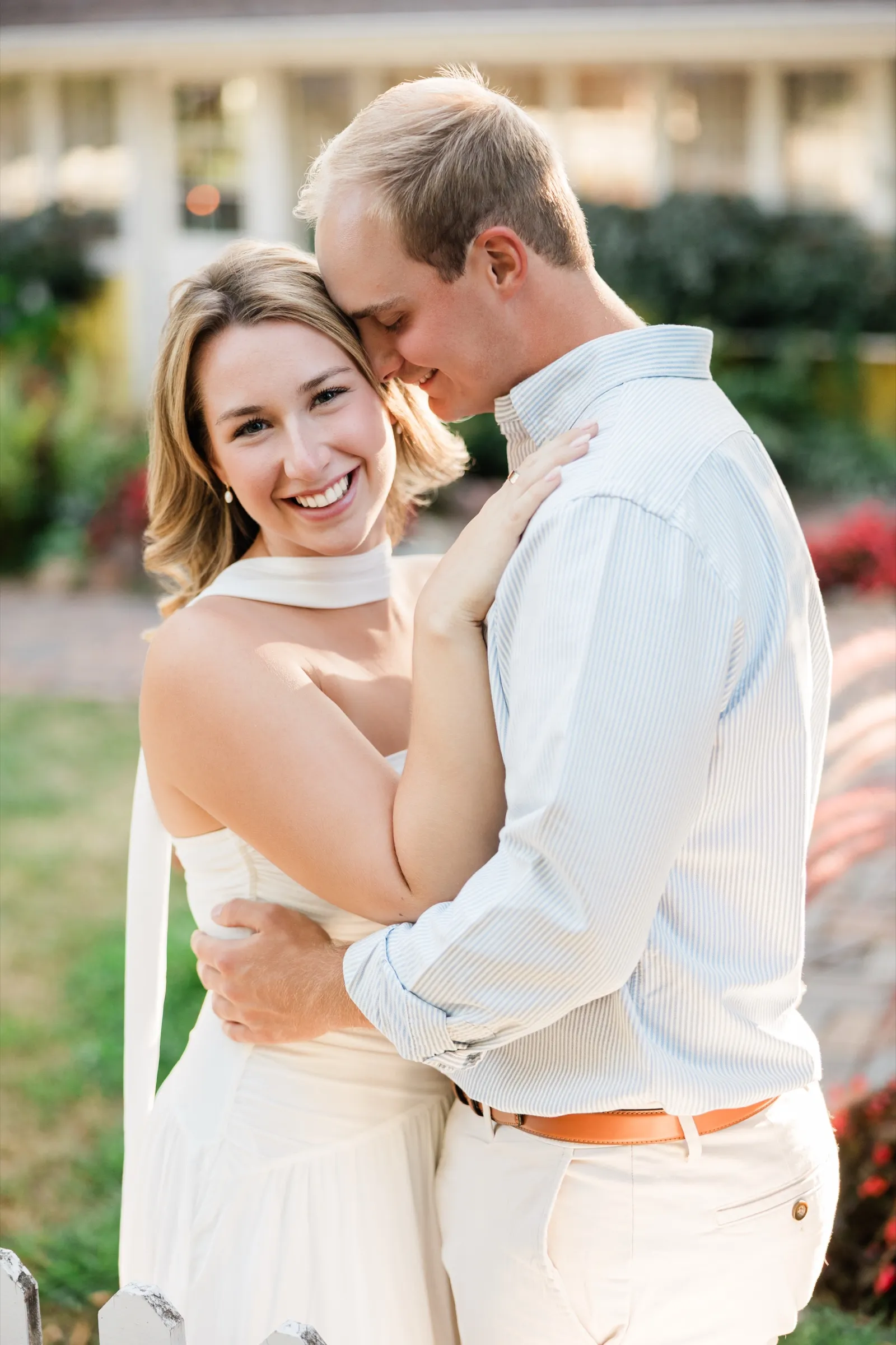 Olivia smiles at the camera while Adam nuzzles her temple with his eyes closed — Tim Larsen Photography