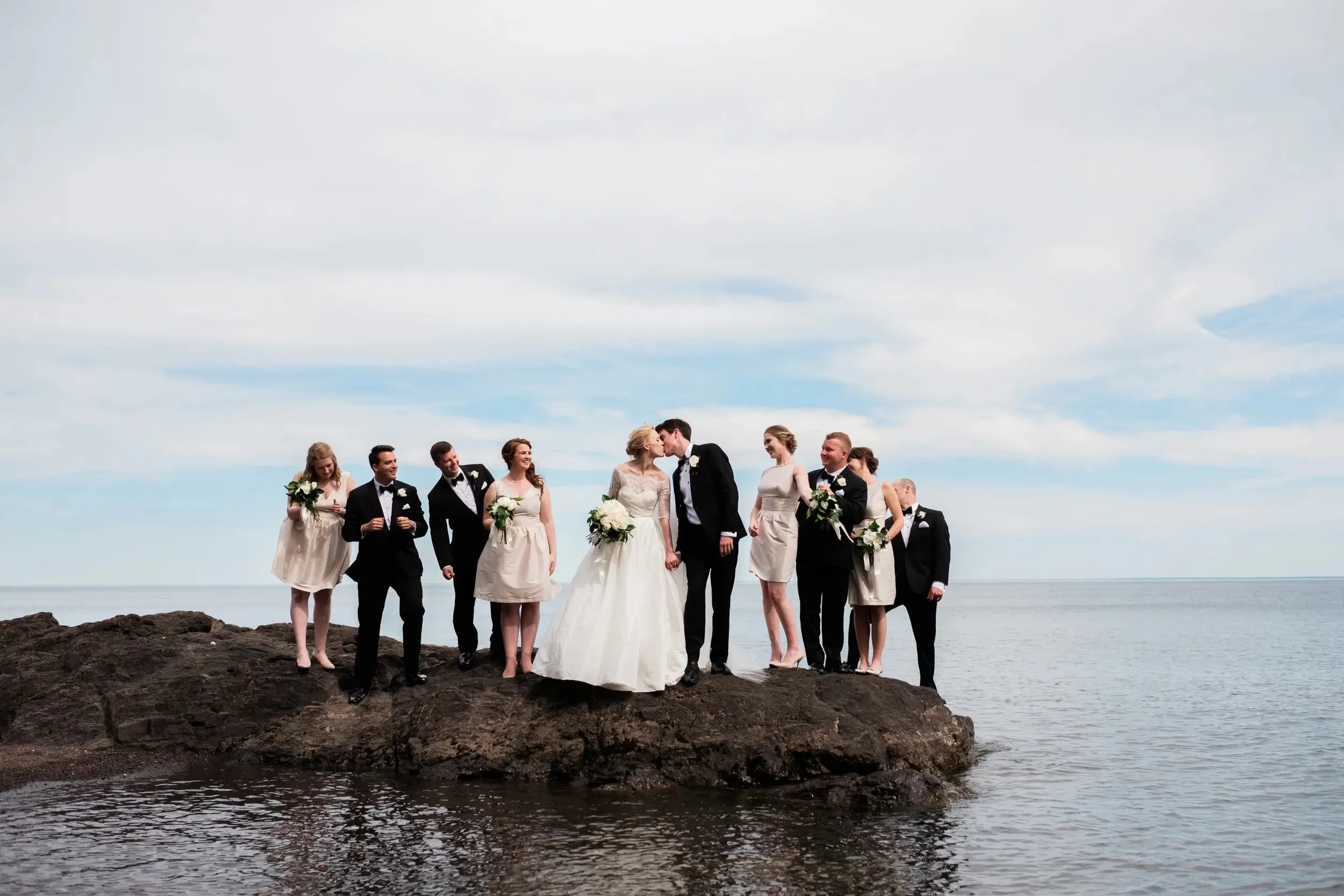 Wedding party on a rock outcropping in Lake Superior, wide horizon of water — Tim Larsen Photography, Brainerd Lakes MN
