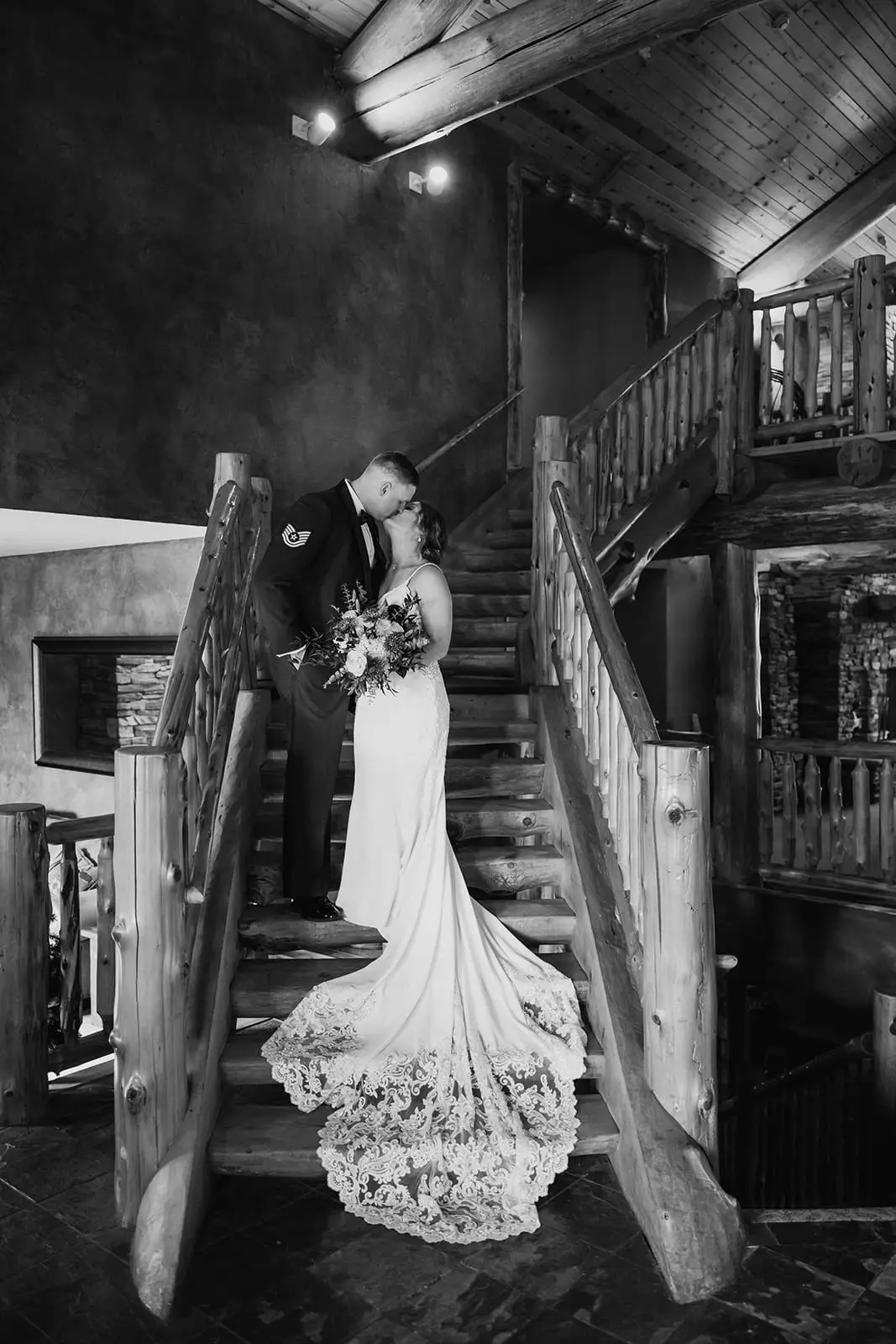 Maid of honor mid-toast as the wedding party erupts in laughter at the head table — Tim Larsen Photography, Brainerd Lakes MN