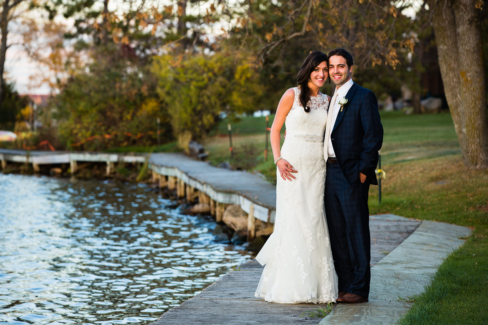 Couple portrait by the pond with fall color reflections at Breezy Point — Tim Larsen Photography, Brainerd Lakes MN