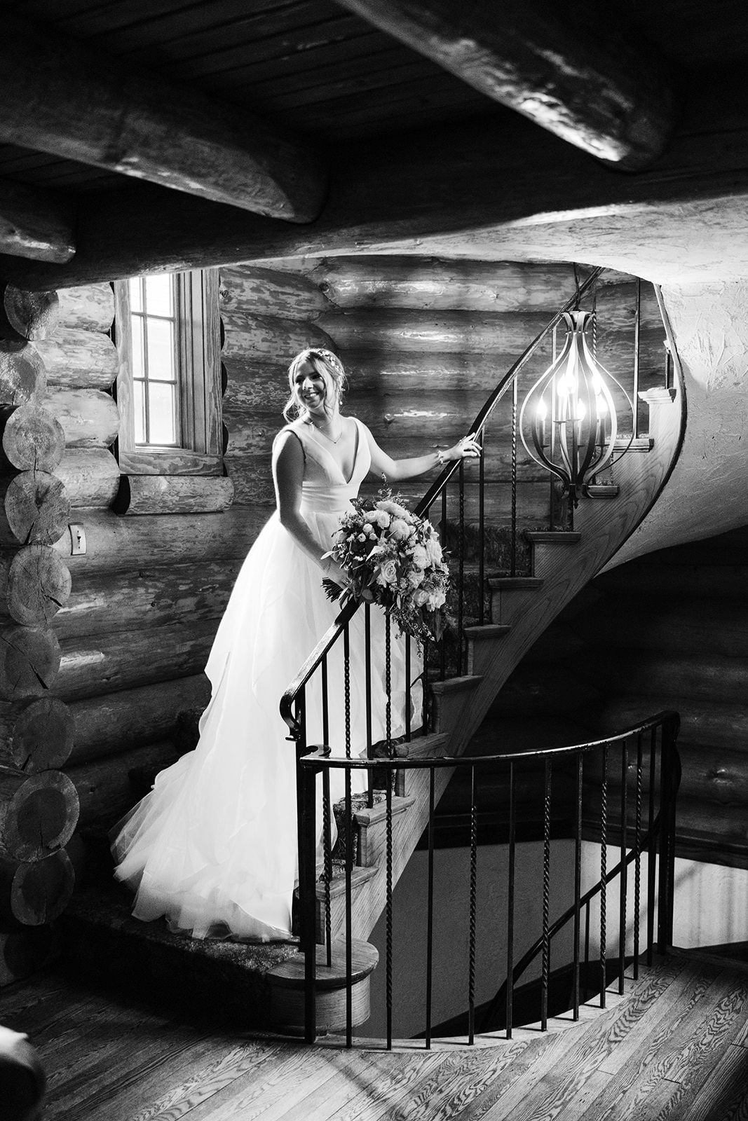 Bride on the spiral log staircase in black and white — Breezy Point Resort — Tim Larsen Photography, Brainerd Lakes MN