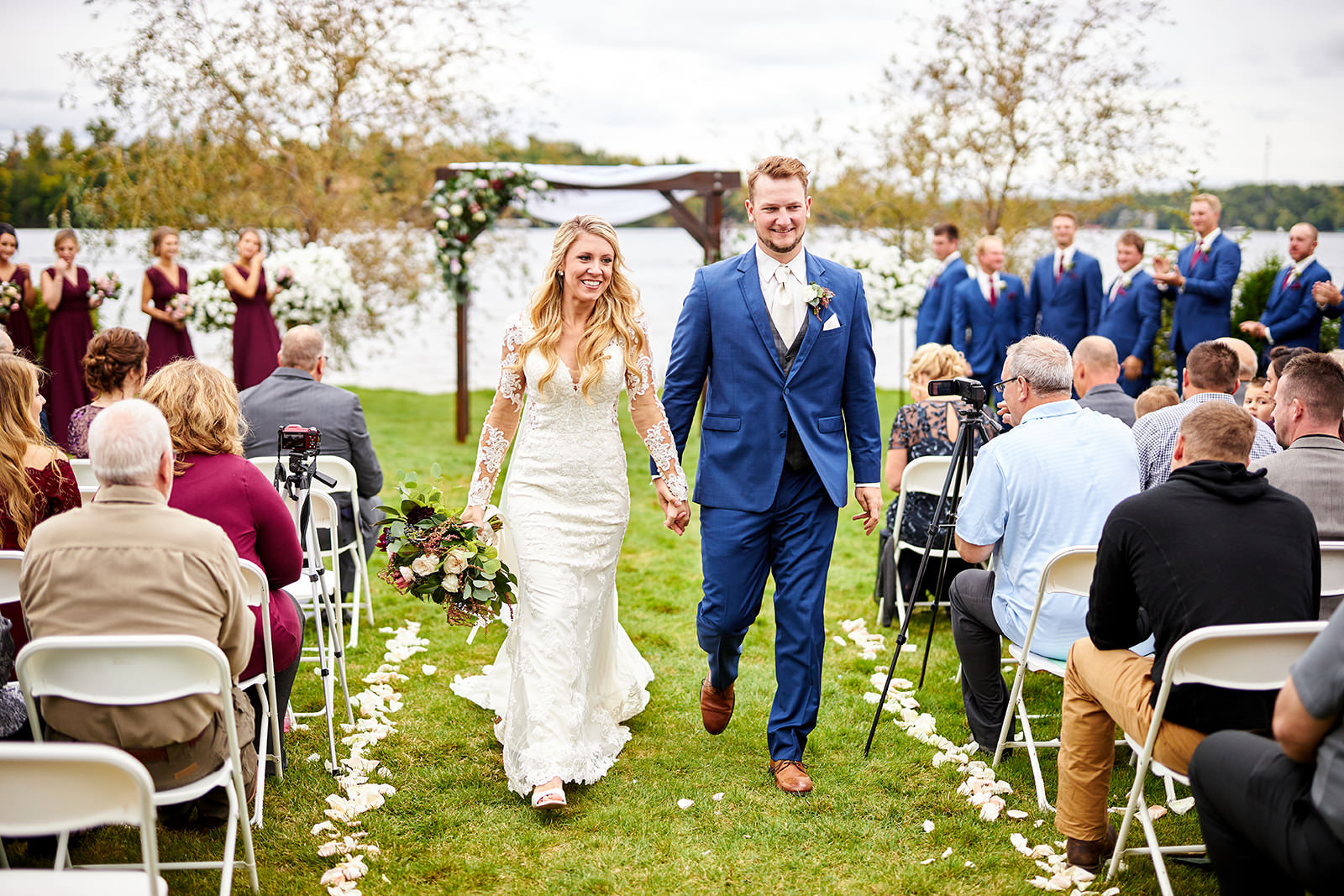 Recessional on the North Lawn — couple walking up the aisle, burgundy bridal party — Tim Larsen Photography, Brainerd Lakes MN