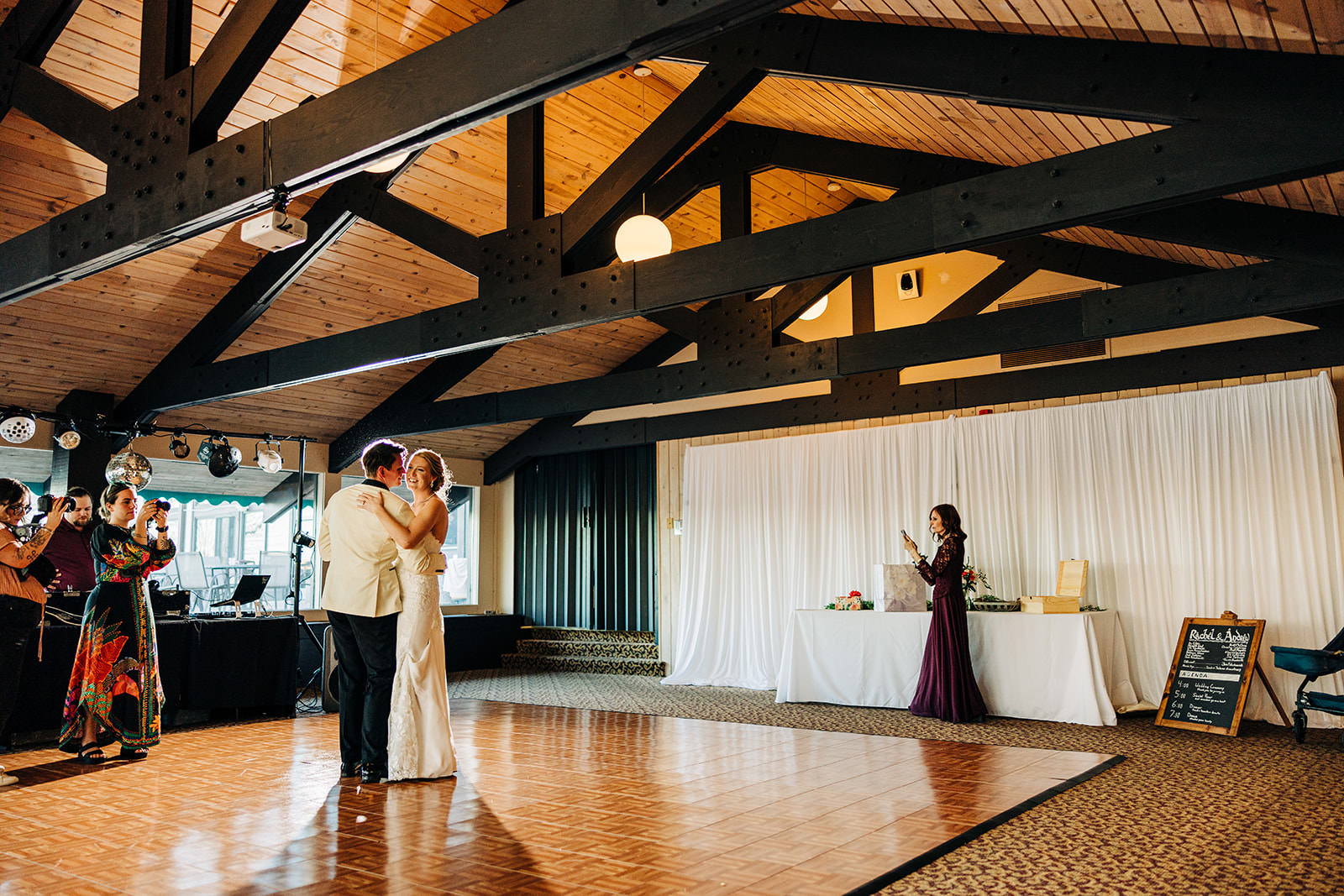 First dance under timber beam ceiling — warm light, ballroom at Cragun's — Tim Larsen Photography, Brainerd Lakes MN