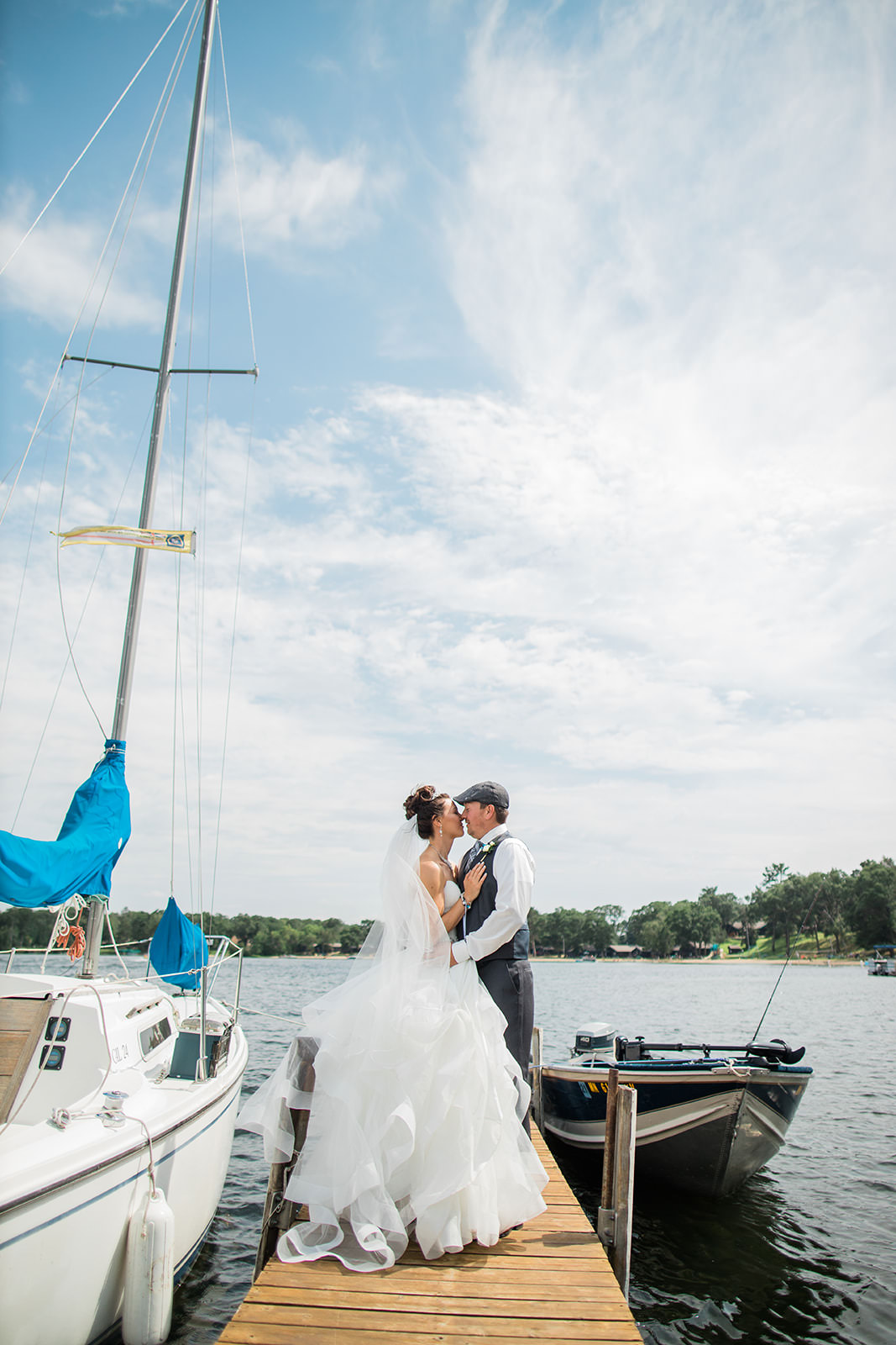 Couple kissing on the dock by the sailboat — Gull Lake and blue sky — Tim Larsen Photography, Brainerd Lakes MN