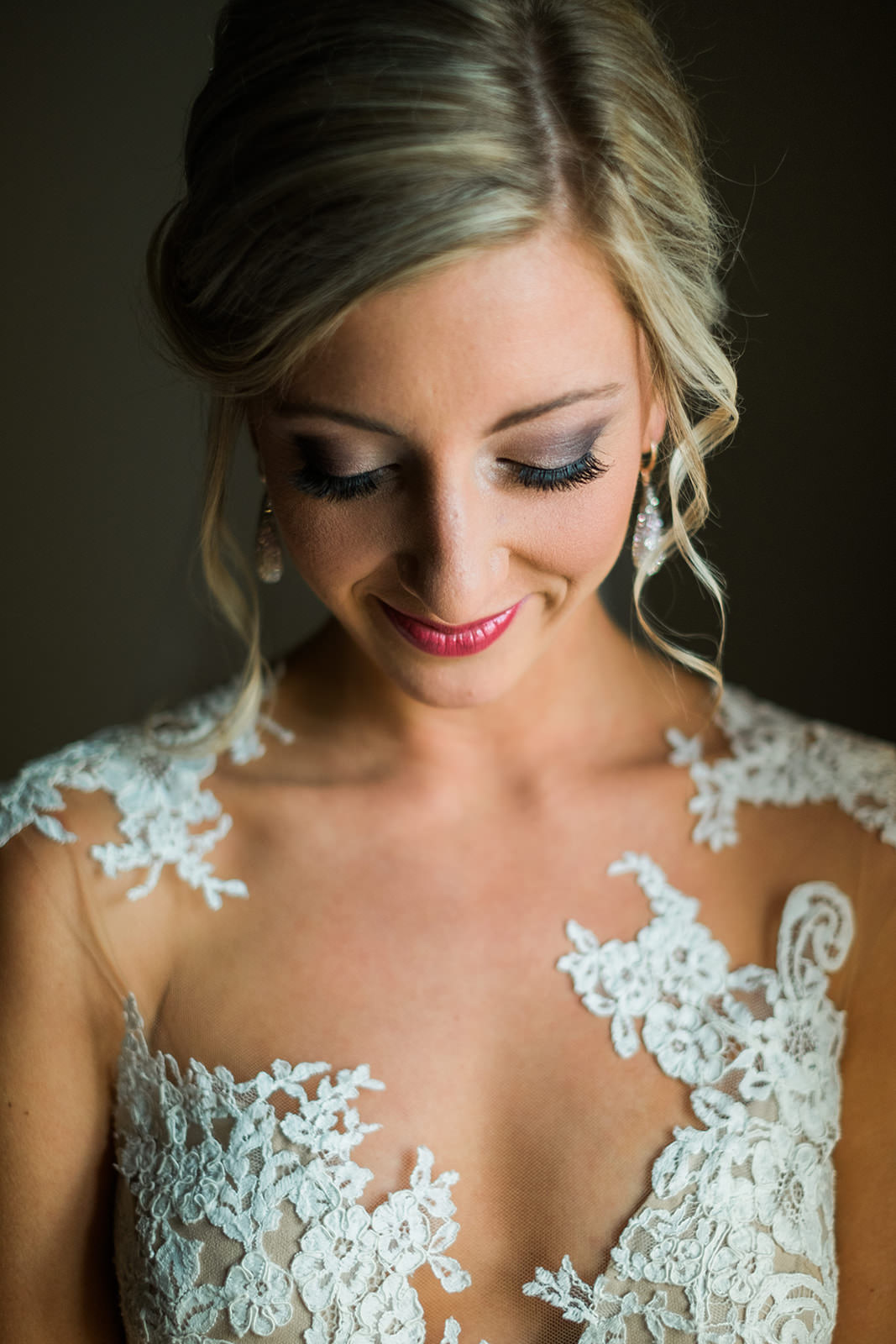 Bride portrait — window light, lace detail, looking down — Tim Larsen Photography, Brainerd Lakes MN
