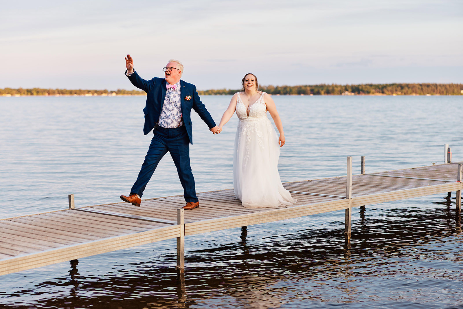 Couple laughing on the dock at golden hour — Gull Lake at Grand View Lodge — Tim Larsen Photography, Brainerd Lakes MN