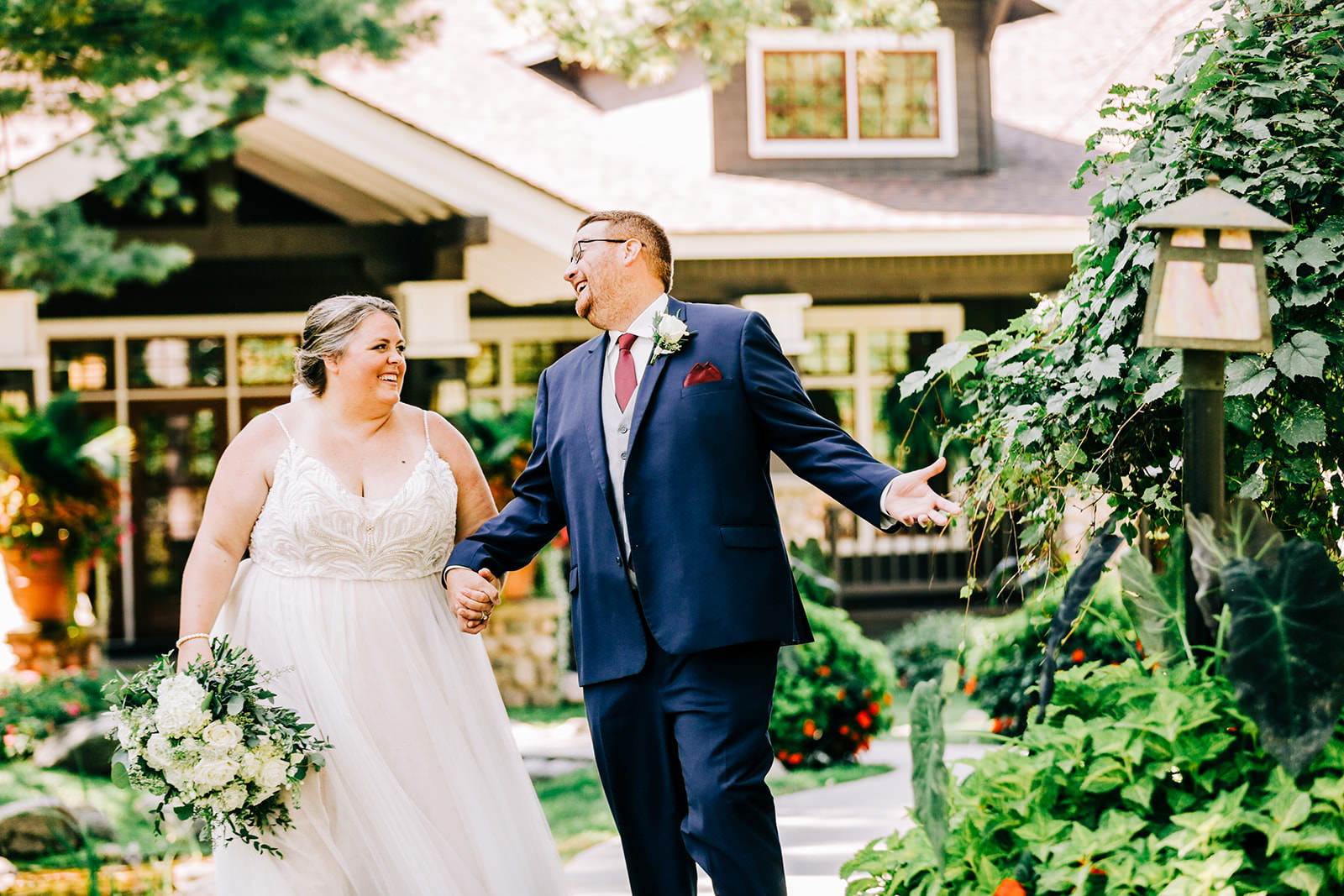 Couple walking through the gardens at Grand View Lodge — summer wedding — Tim Larsen Photography, Brainerd Lakes MN