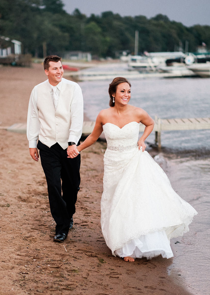 Couple walking on the beach at Gull Lake — Grand View Lodge marina behind — Tim Larsen Photography, Brainerd Lakes MN