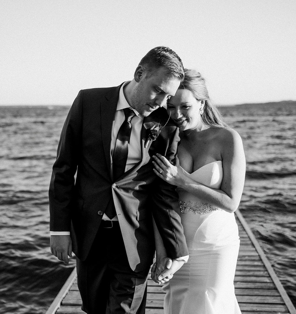 Couple walking on the dock on Gull Lake in black and white — Tim Larsen Photography, Brainerd Lakes MN