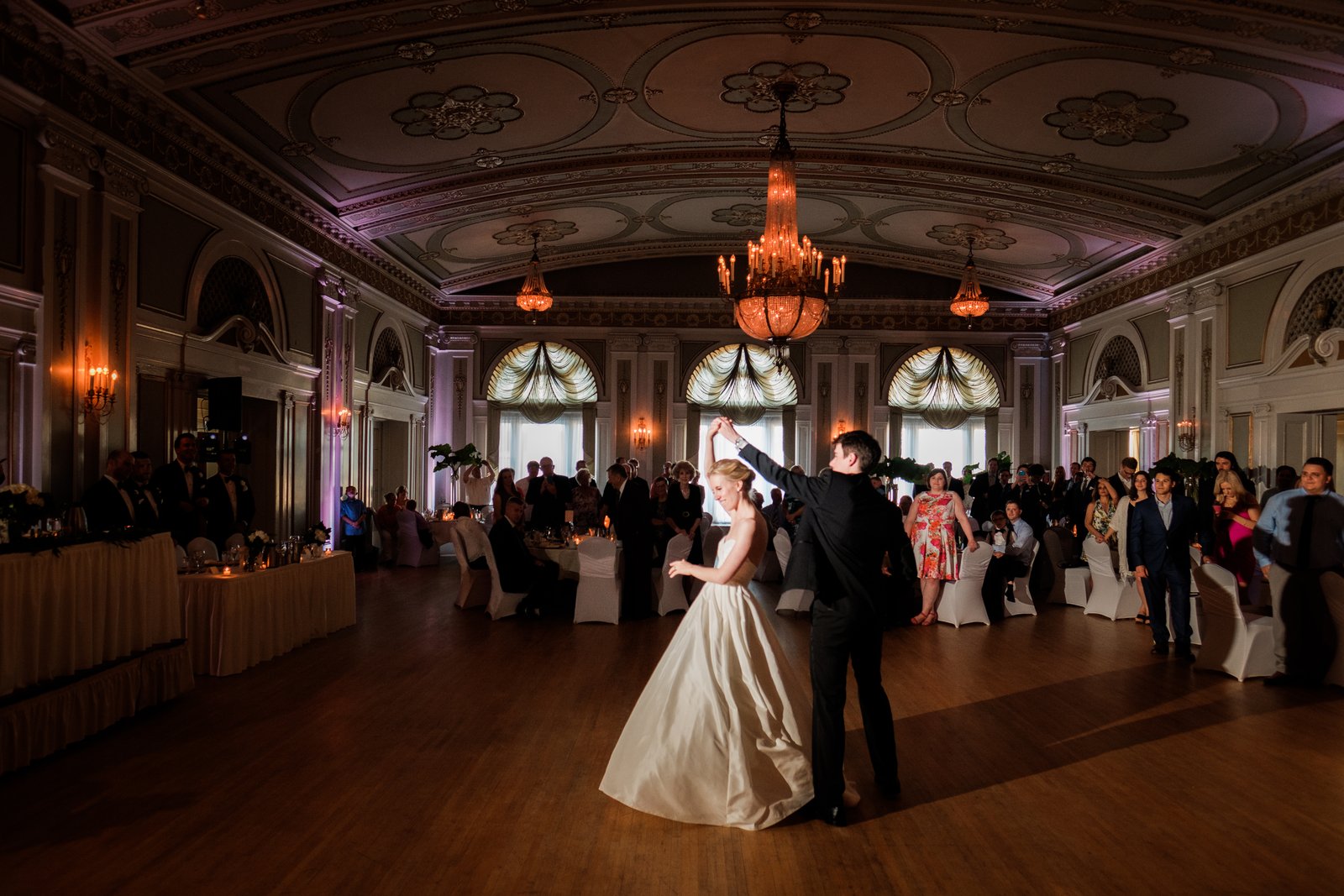 Intimate first dance at the Greysolon Ballroom — uplighting and chandeliers, summer — Tim Larsen Photography, Duluth MN