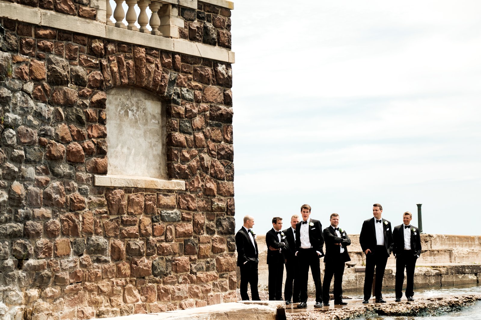 Groomsmen on the Lake Superior stone pier — summer Duluth wedding — Tim Larsen Photography, Duluth MN