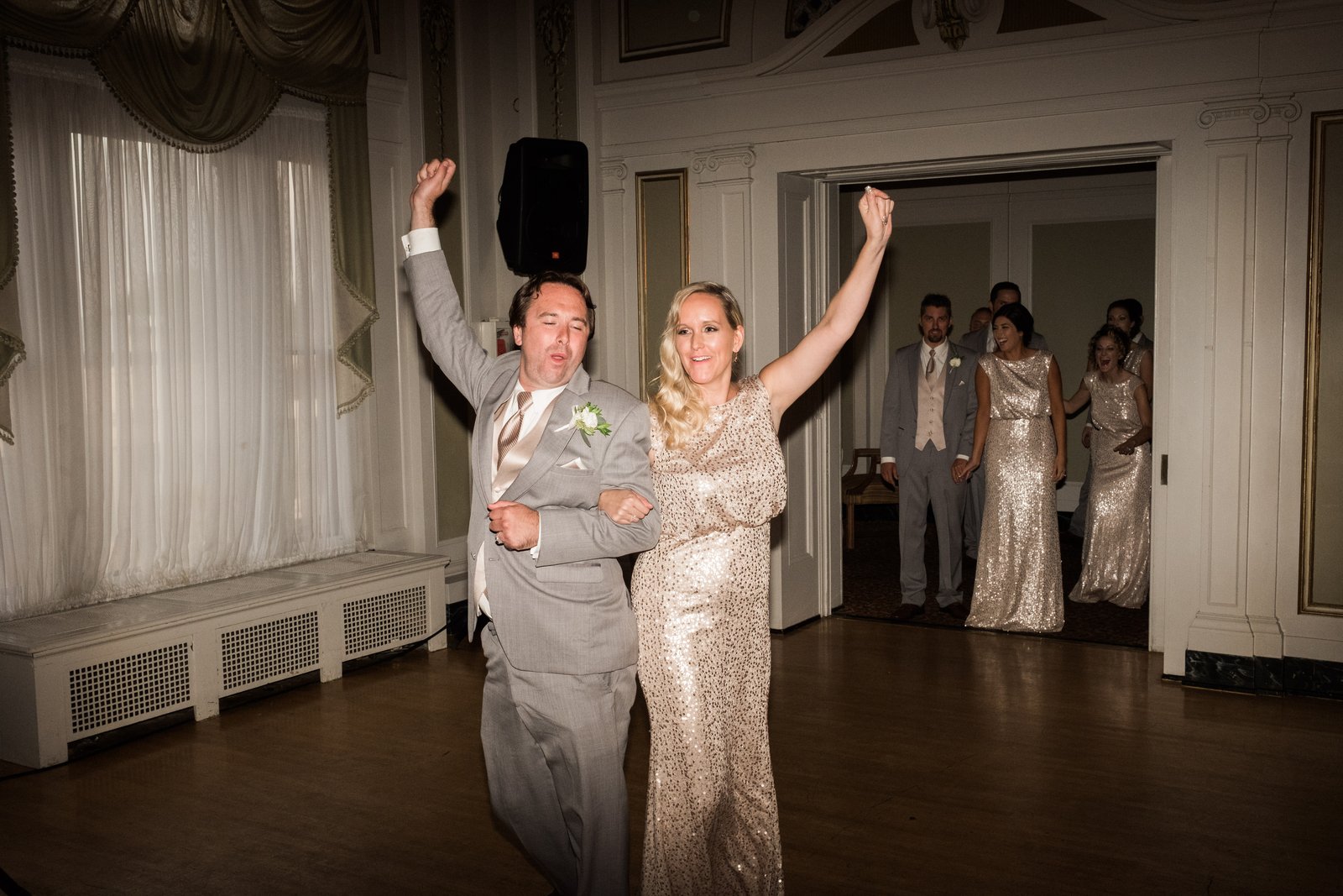Celebratory grand entrance into the Greysolon Ballroom — autumn wedding — Tim Larsen Photography, Duluth MN