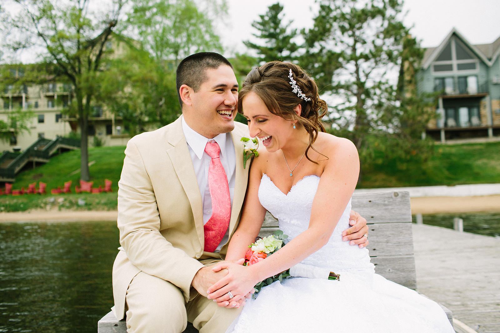 Couple laughing on the dock — spring wedding at Madden's on Gull Lake — Tim Larsen Photography, Brainerd Lakes MN