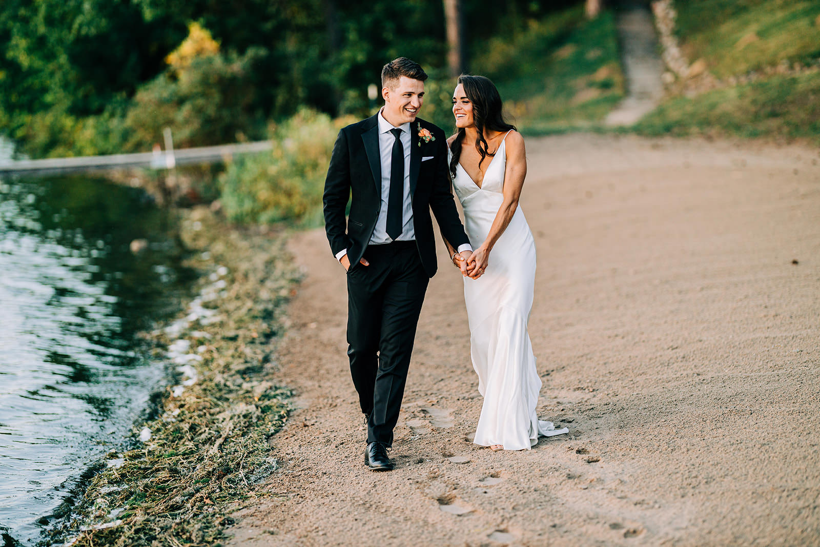Couple walking on the beach at Gull Lake — holding hands at golden hour — Tim Larsen Photography, Brainerd Lakes MN
