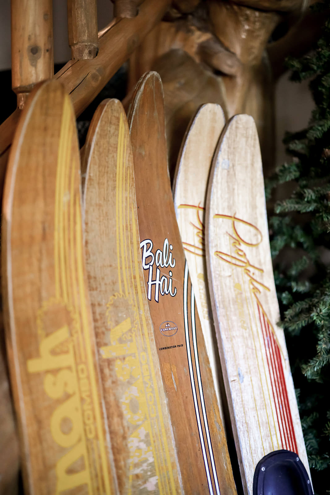 Vintage water skis lined up against the lodge wall — Bali Hai detail — Tim Larsen Photography, Brainerd Lakes MN