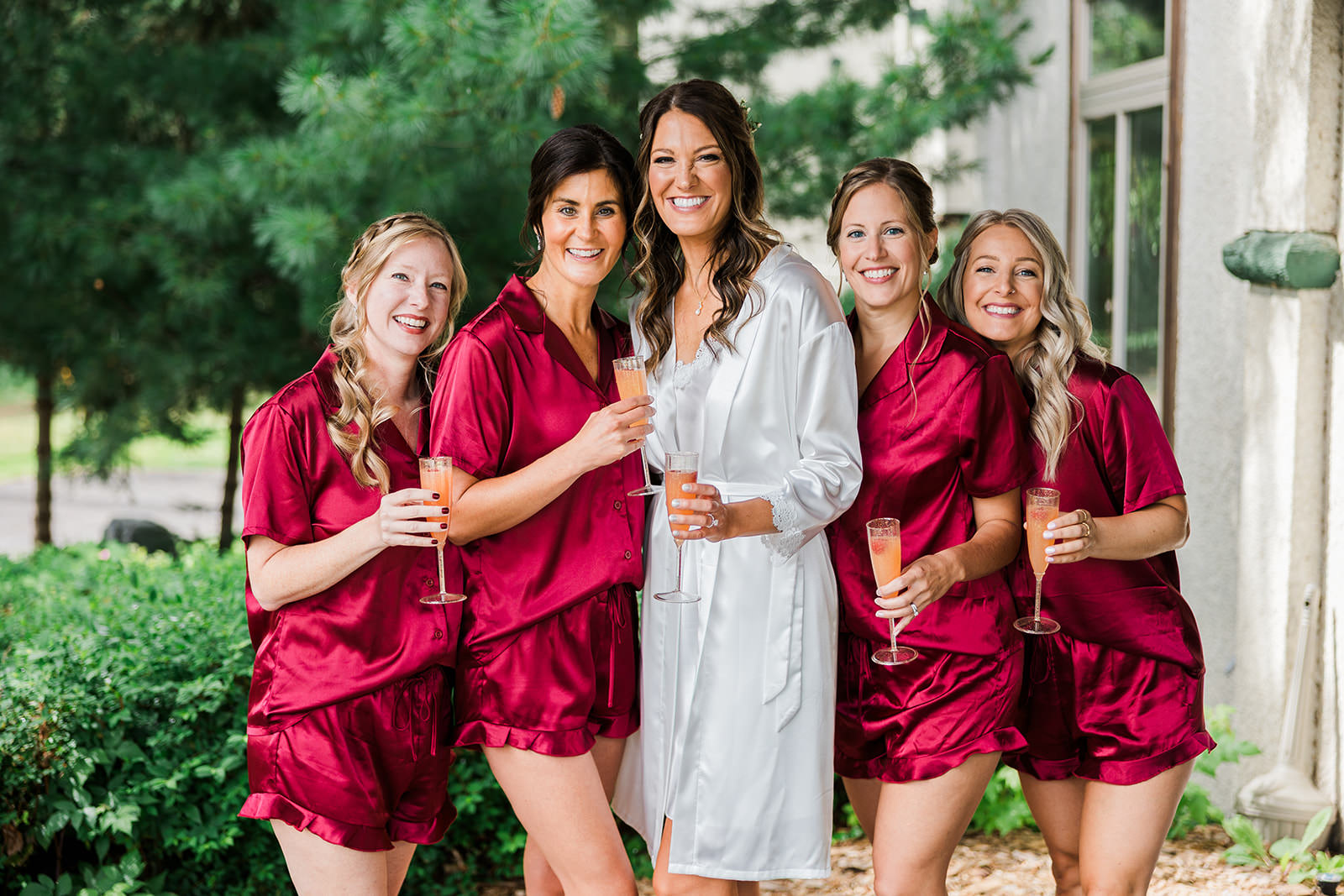 Bride and bridesmaids in burgundy robes with champagne — getting ready outside the lodge — Tim Larsen Photography, Brainerd Lakes MN