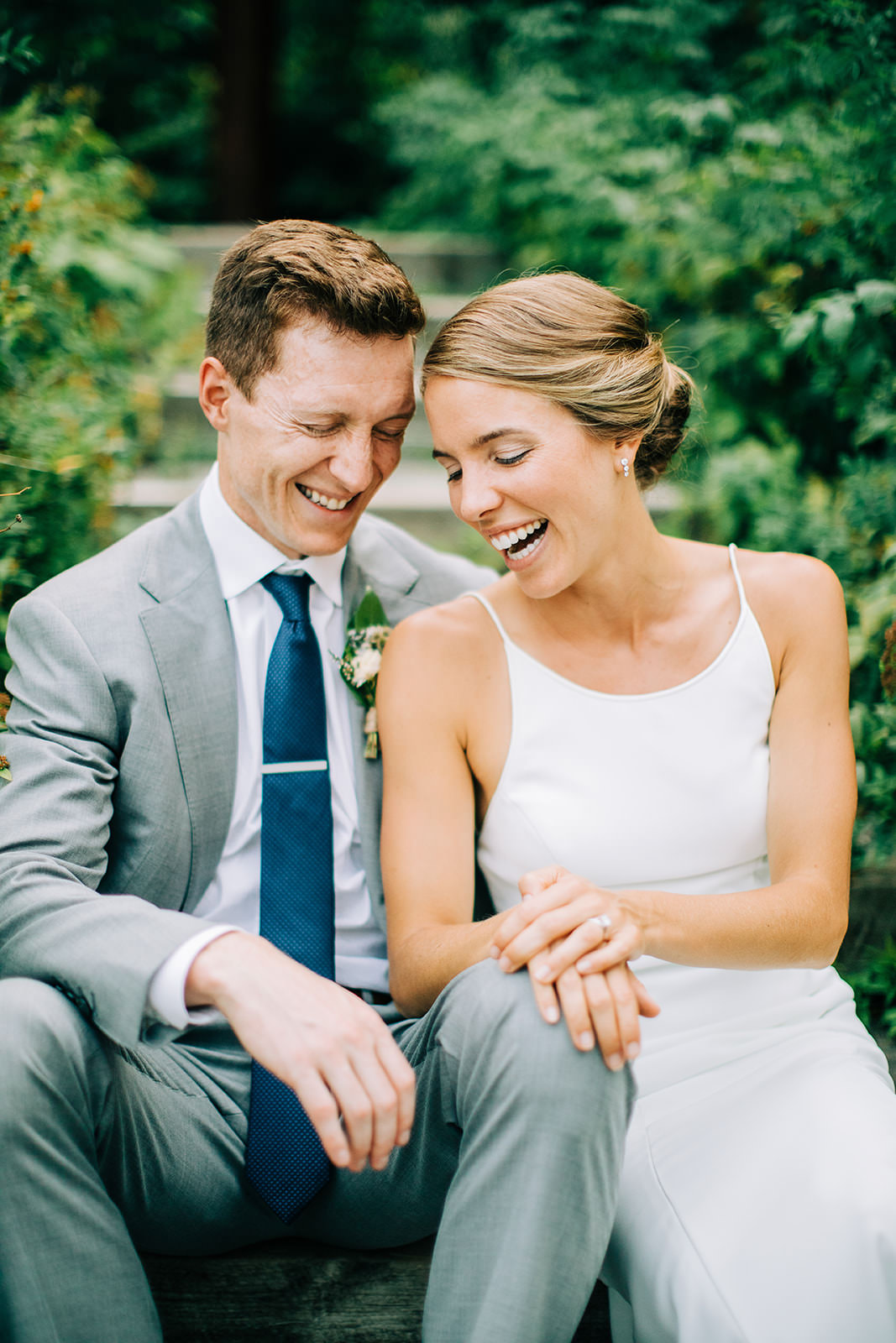 Couple laughing together on the garden path at Manhattan Beach Lodge — Tim Larsen Photography, Brainerd Lakes MN
