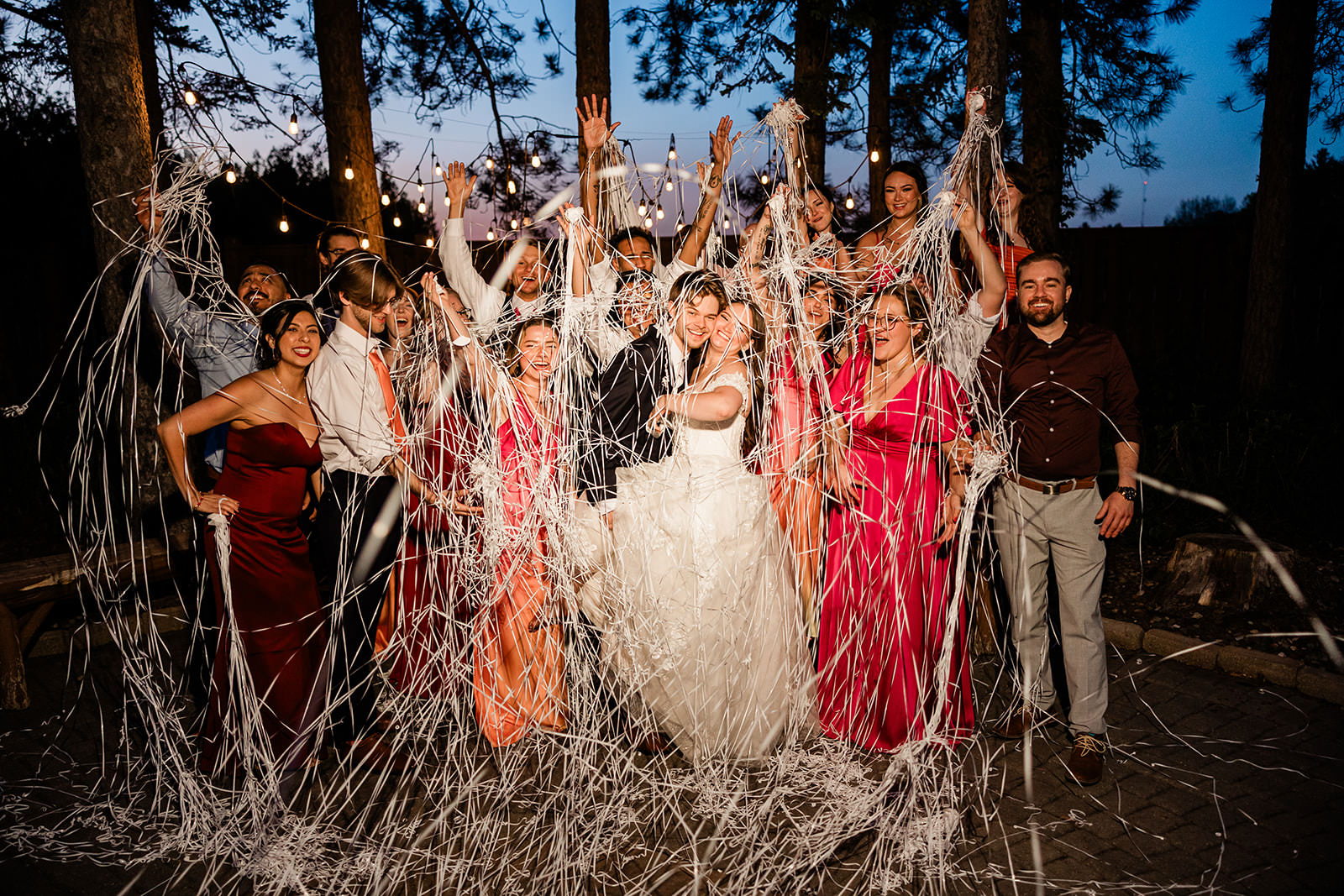 Wedding party with streamers at night in the pine forest — celebration send-off — Tim Larsen Photography, Brainerd Lakes MN