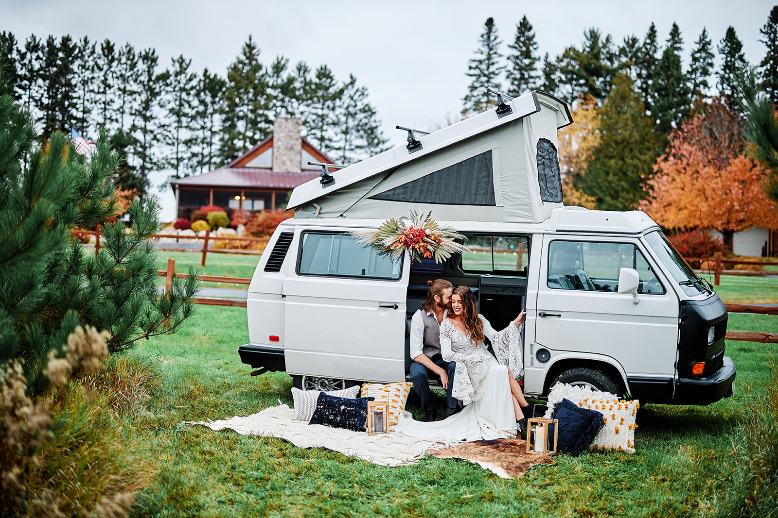 Couple sitting in a VW van with blankets and fall flowers — styled shoot at Pine Peaks — Tim Larsen Photography, Brainerd Lakes MN