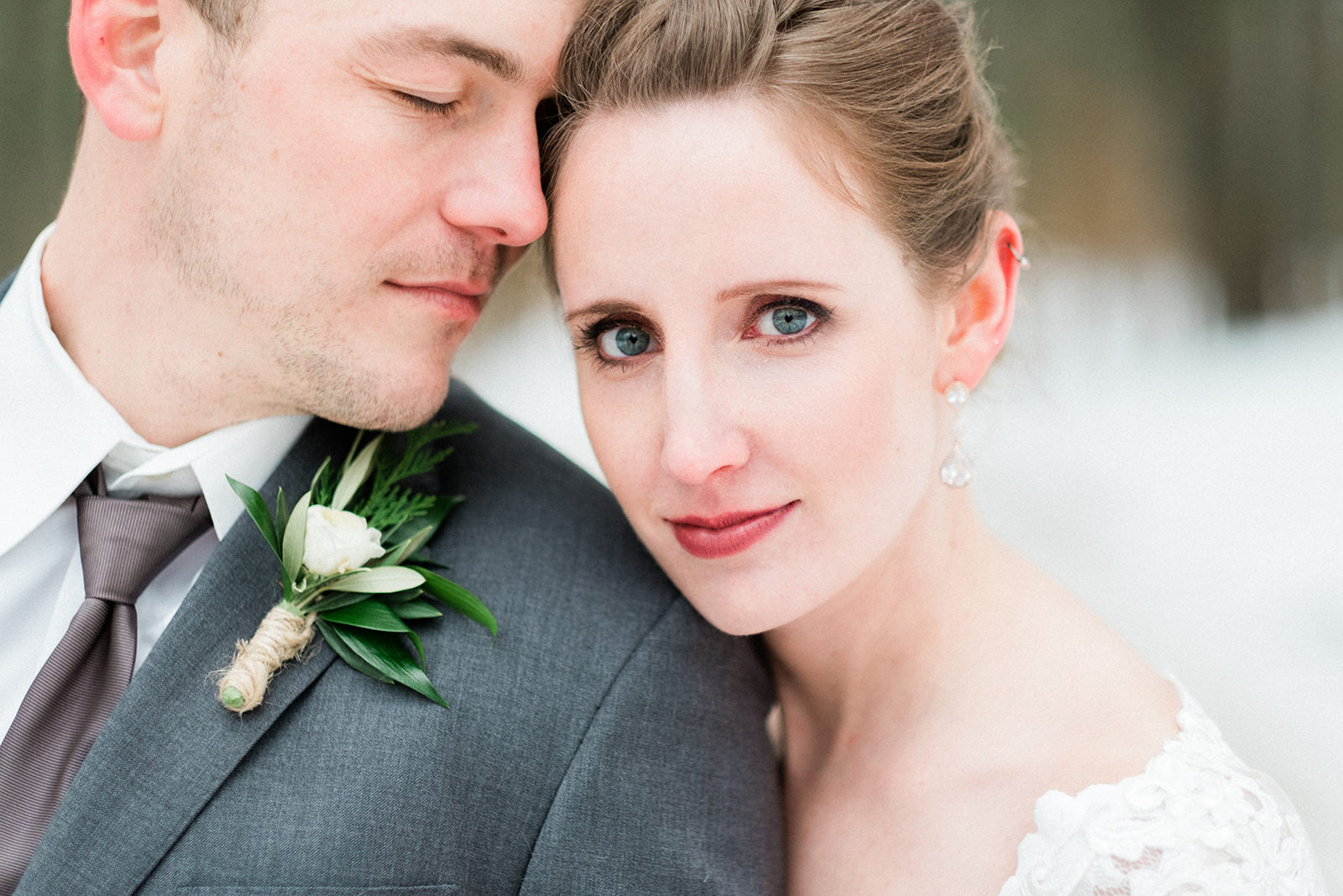 Close-up winter portrait — couple foreheads together in fur wrap — Tim Larsen Photography, Brainerd Lakes MN
