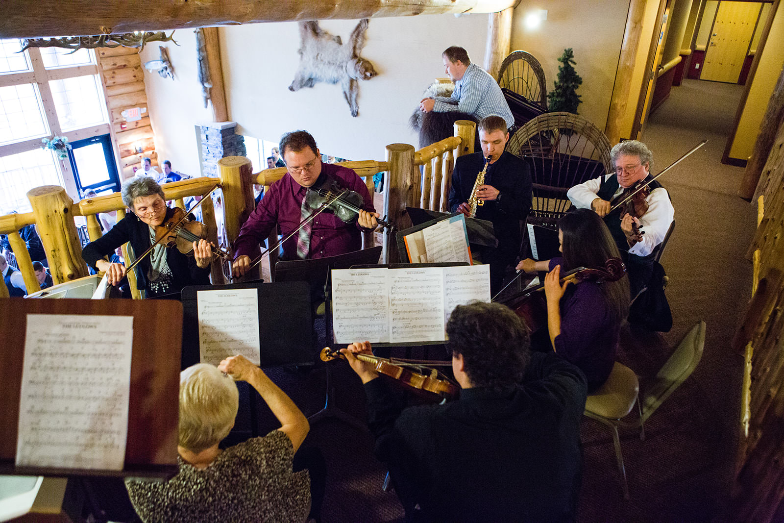 String quartet performing in the lodge lobby at Whitefish Lodge — Tim Larsen Photography, Brainerd Lakes MN