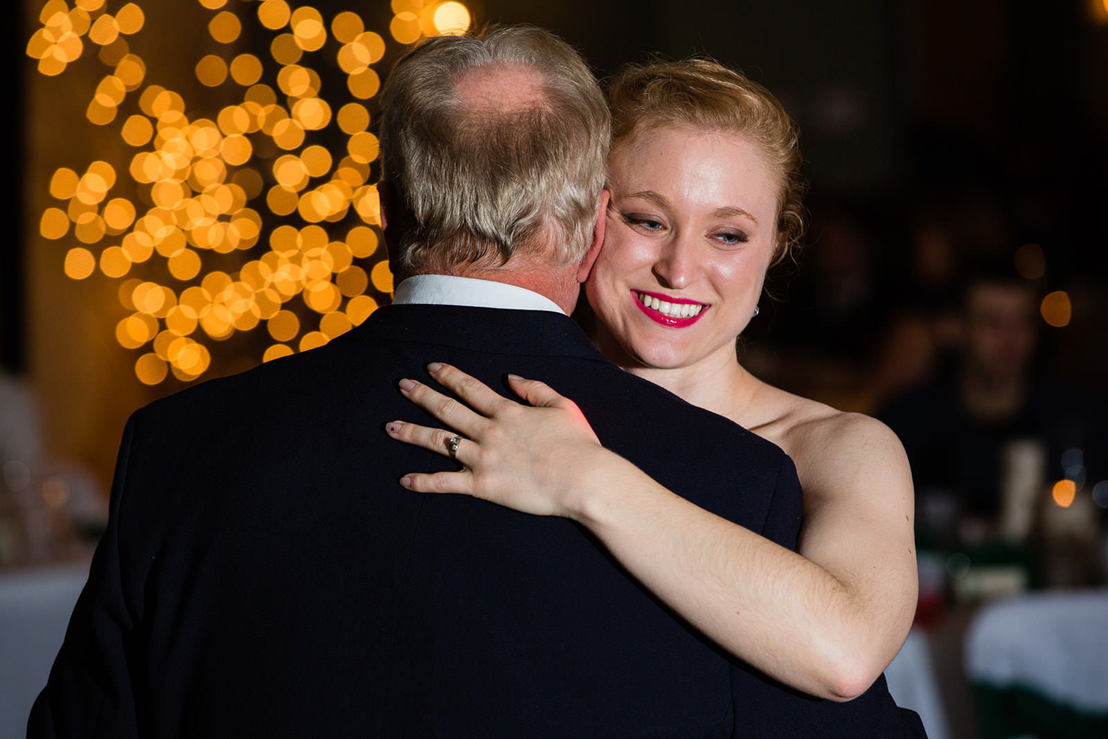 Father-daughter dance with bokeh string lights at Whitefish Lodge reception — Tim Larsen Photography, Brainerd Lakes MN