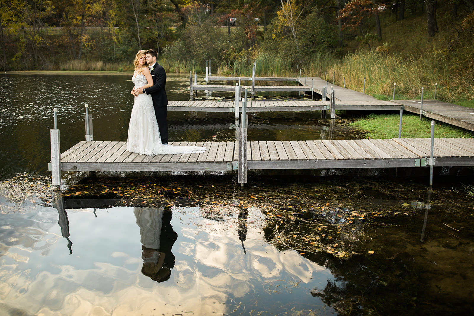 Couple on the dock with fall reflections on the Whitefish Chain — Tim Larsen Photography, Brainerd Lakes MN