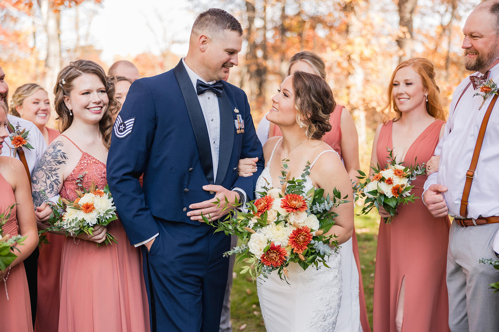 Couple with wedding party walking through fall color at Whitefish Lodge — Tim Larsen Photography, Brainerd Lakes MN