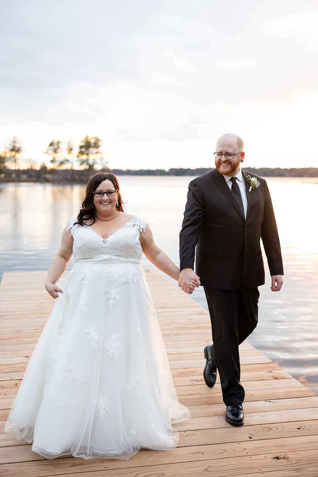 Couple walking on the dock at sunset on the Whitefish Chain — Tim Larsen Photography, Brainerd Lakes MN