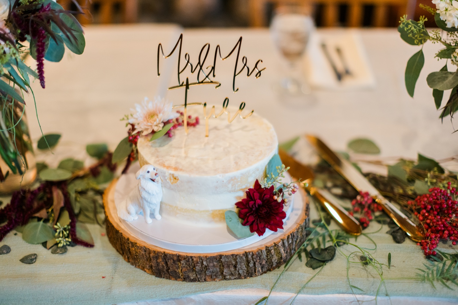 Semi-naked wedding cake with Mr & Mrs topper and dahlias on the sweetheart table at Manhattan Beach Lodge — Tim Larsen Photography, Brainerd Lakes MN