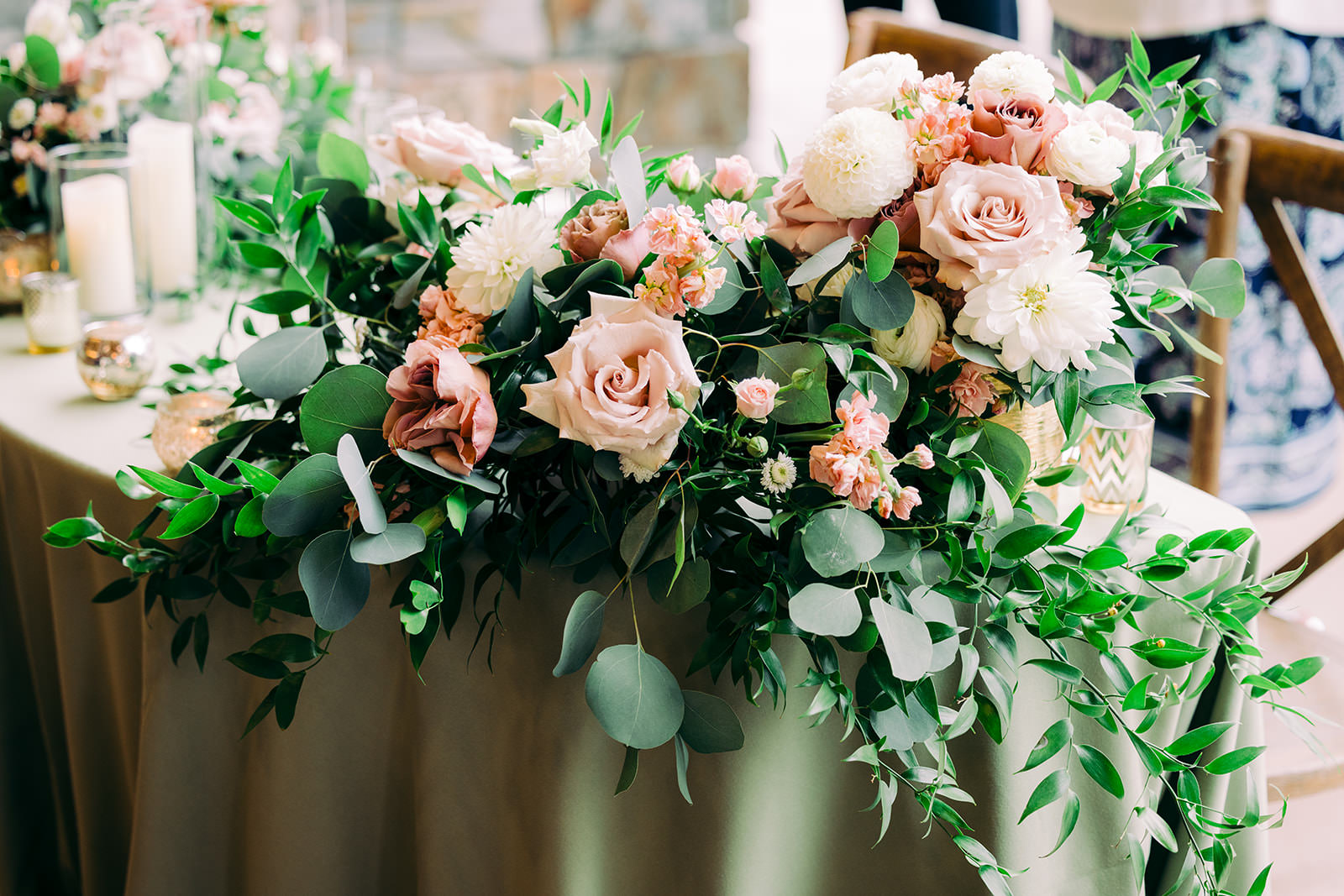 Head table floral runner — blush roses, white dahlias, and eucalyptus cascading over the edge — Tim Larsen Photography, Brainerd Lakes MN