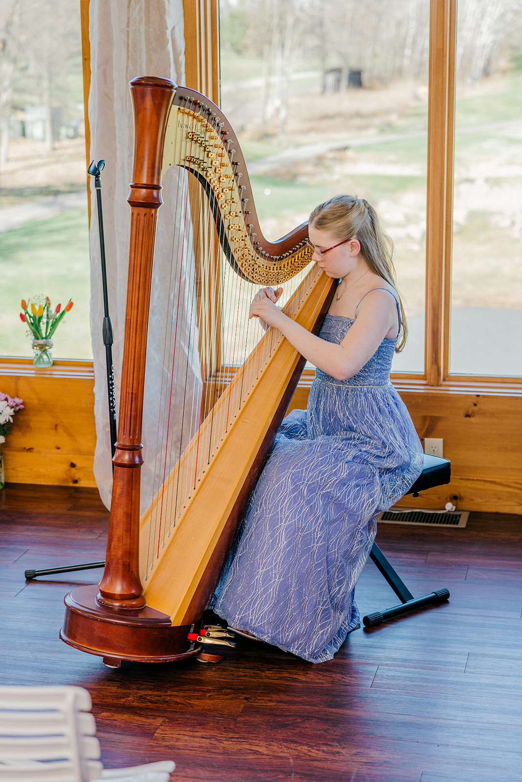 Harpist in lavender gown playing a full pedal harp during the Audubon Room ceremony at Cragun's Legacy Golf Course — Tim Larsen Photography, Brainerd Lakes MN