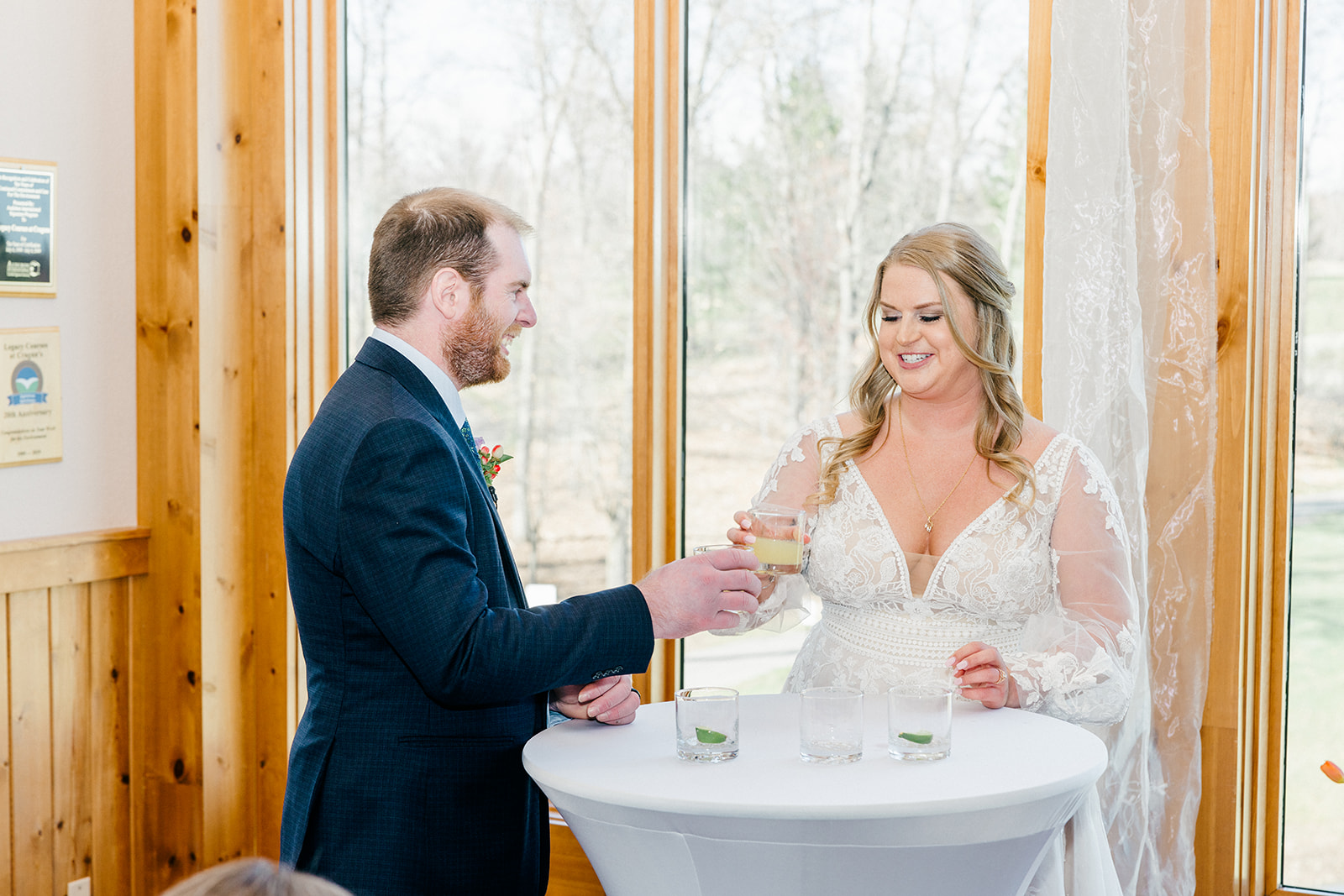 Unity ceremony at a cocktail table in the Audubon Room, bride and groom combining small glasses — Tim Larsen Photography, Brainerd Lakes MN