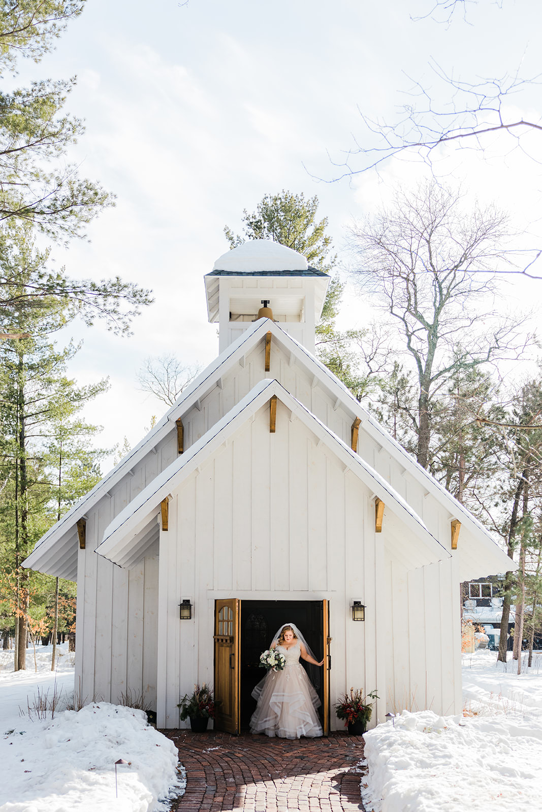 Bride standing in the doorway of The Chapel at Grand View Lodge — winter — Tim Larsen Photography, Brainerd Lakes MN