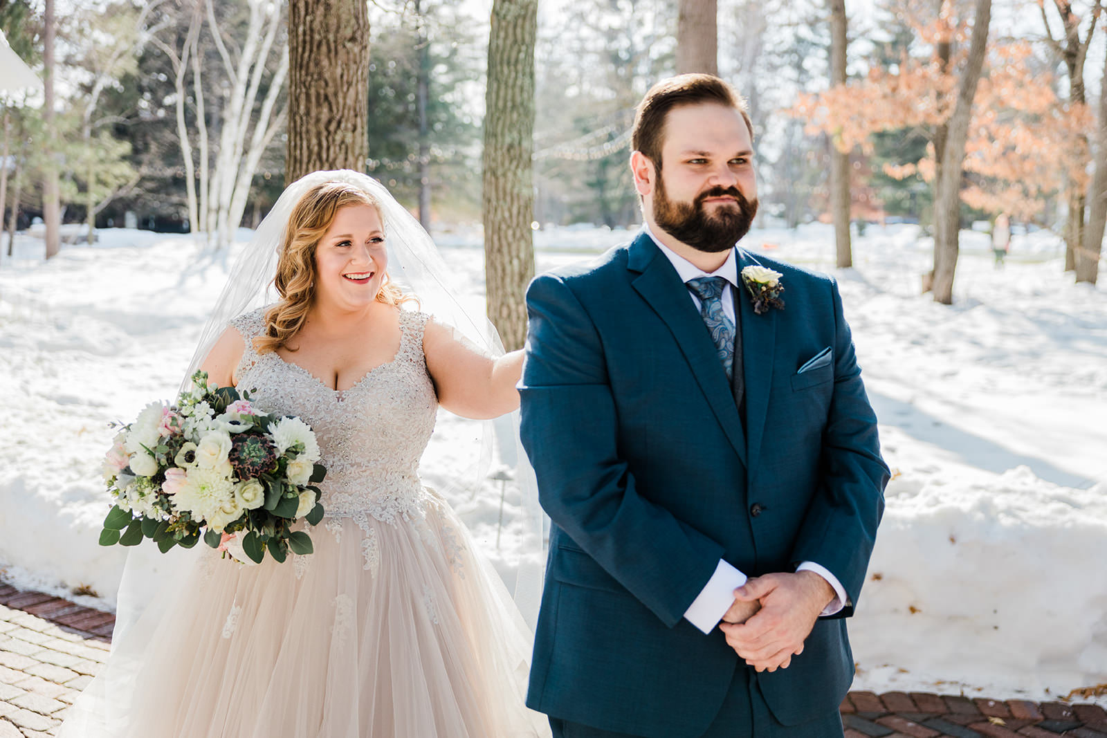 First look — Lauren tapping Matthew on the shoulder in the snow at Grand View Lodge — Tim Larsen Photography, Brainerd Lakes MN